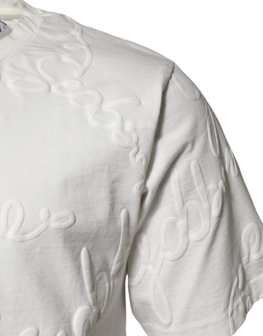 White long sleeve sweater with embroidered design on front