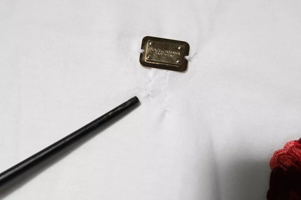 Gold button on white fabric