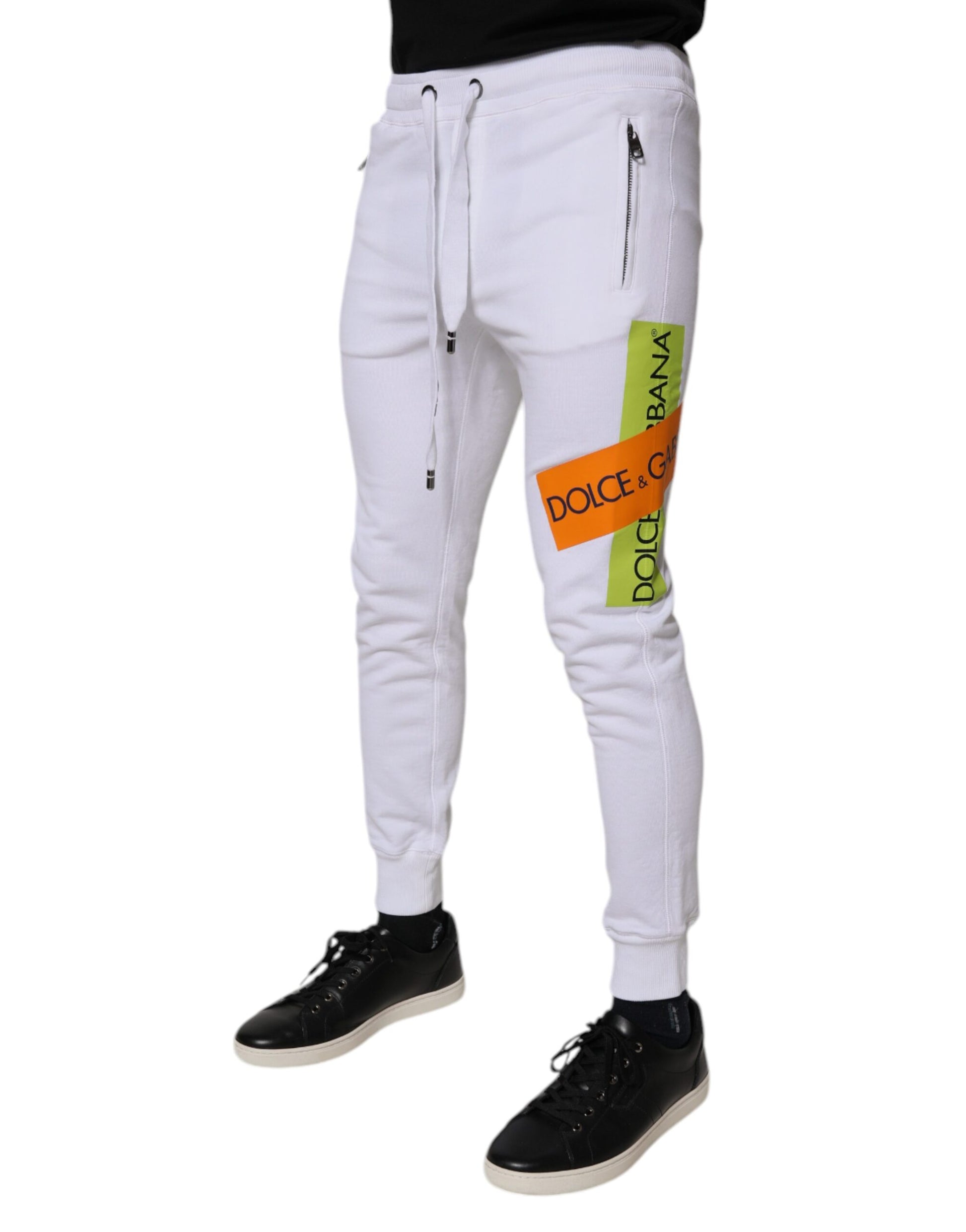 White pants with yellow writing on side