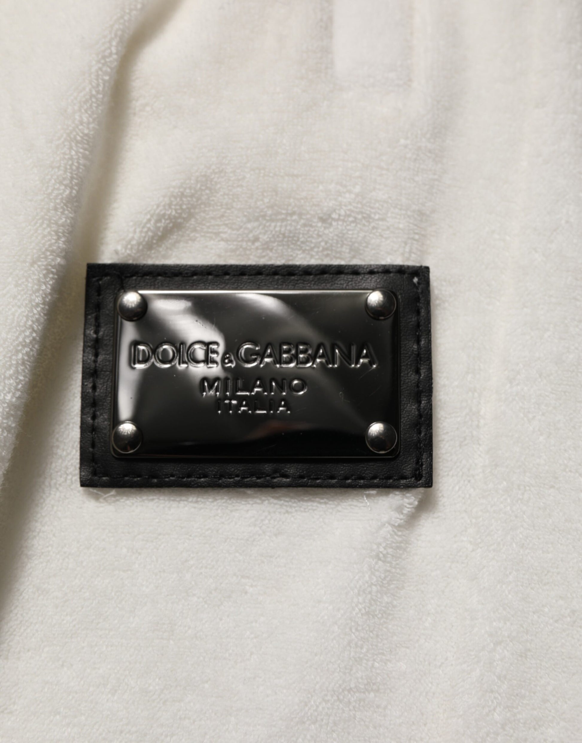 Black leather label on white fabric