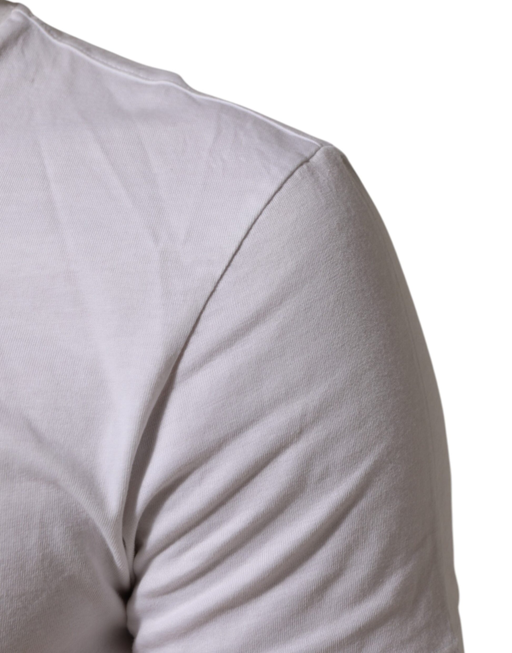 White short sleeve shirt on man's shoulder