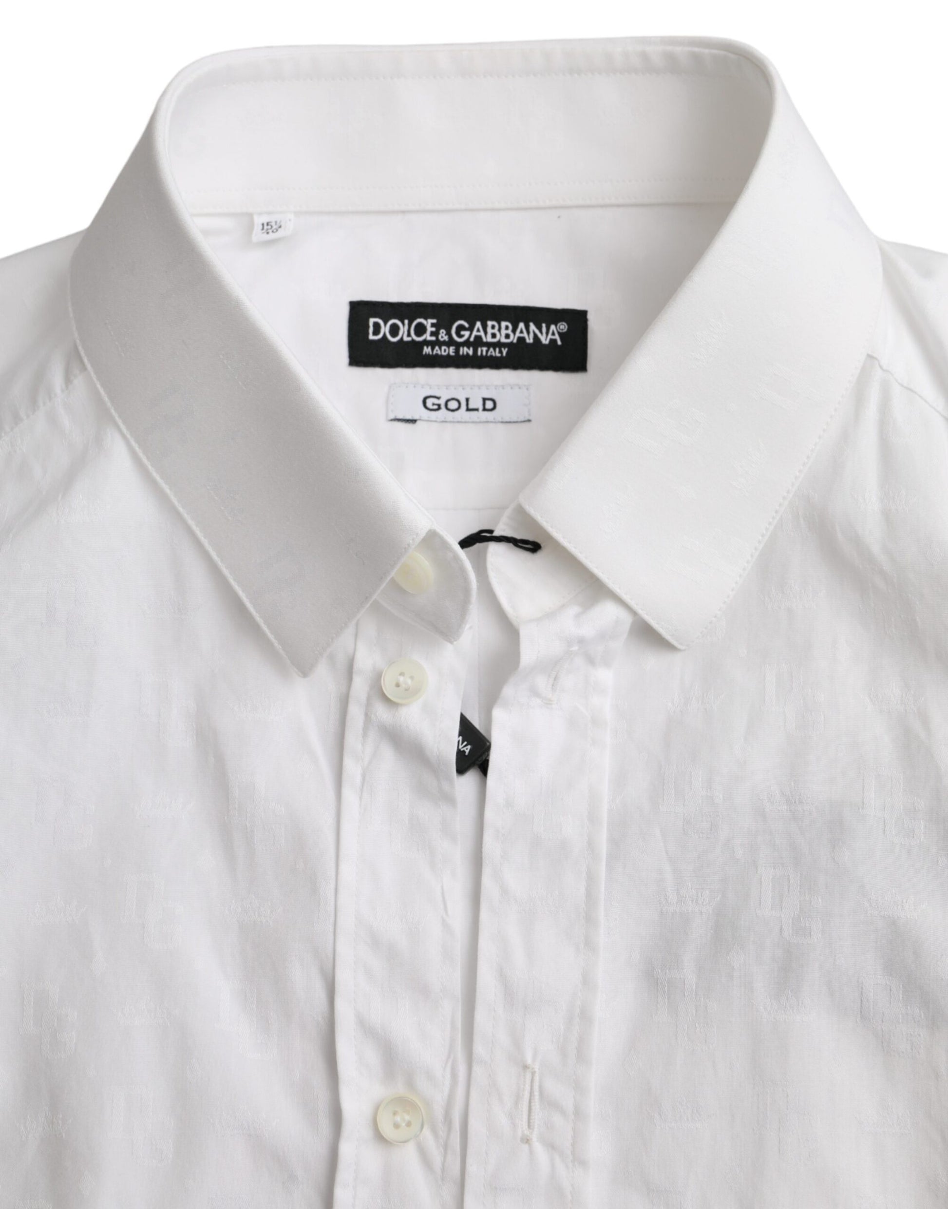 A white cotton long sleeve dress shirt with gold lettering on the collar