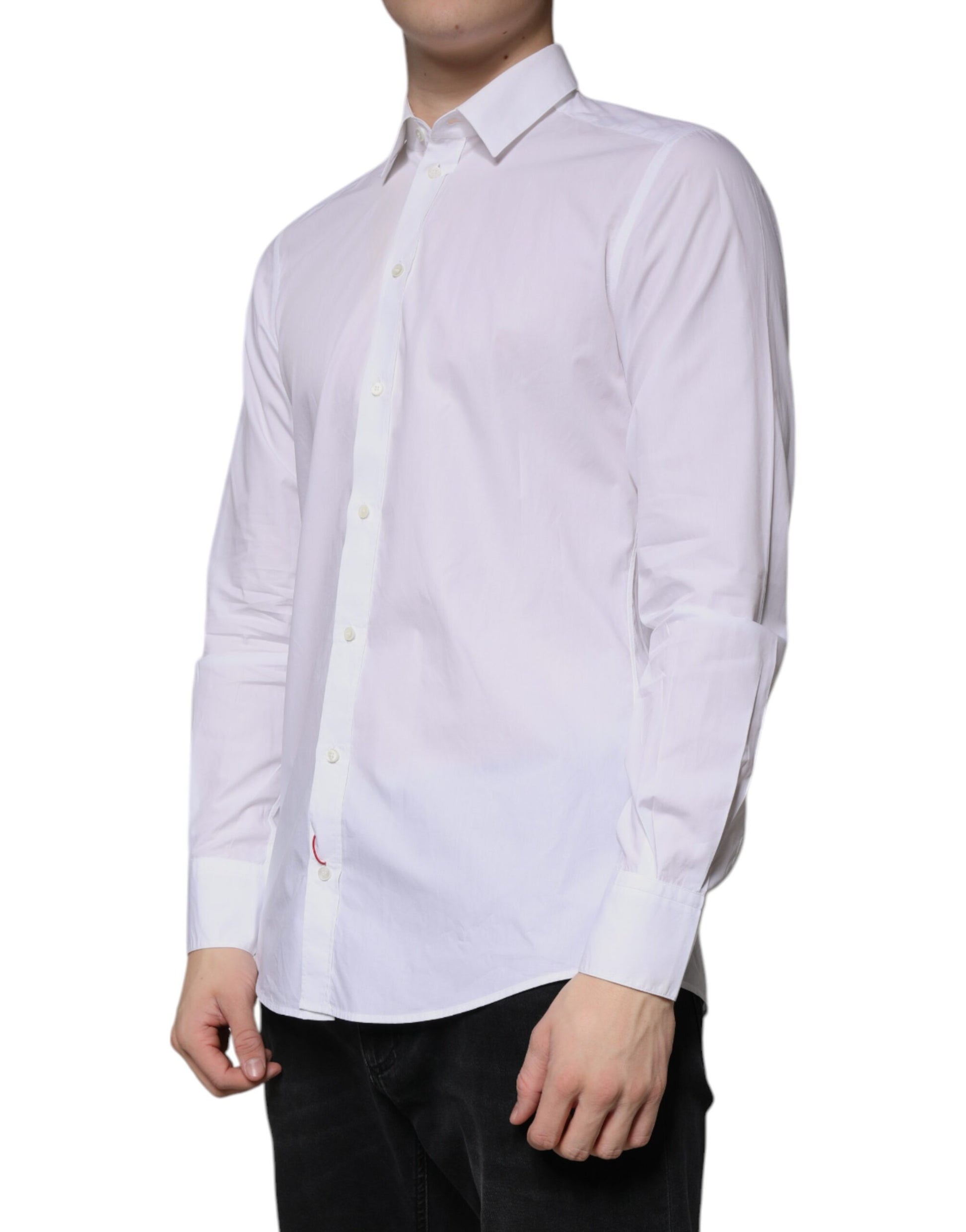 A long sleeved white cotton dress shirt with a collar and button-up front