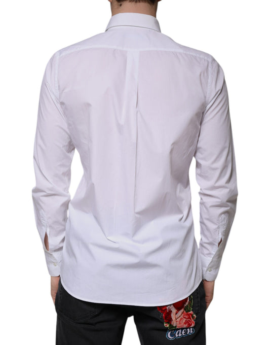 A white cotton long sleeve formal dress shirt with a collar and buttoned front