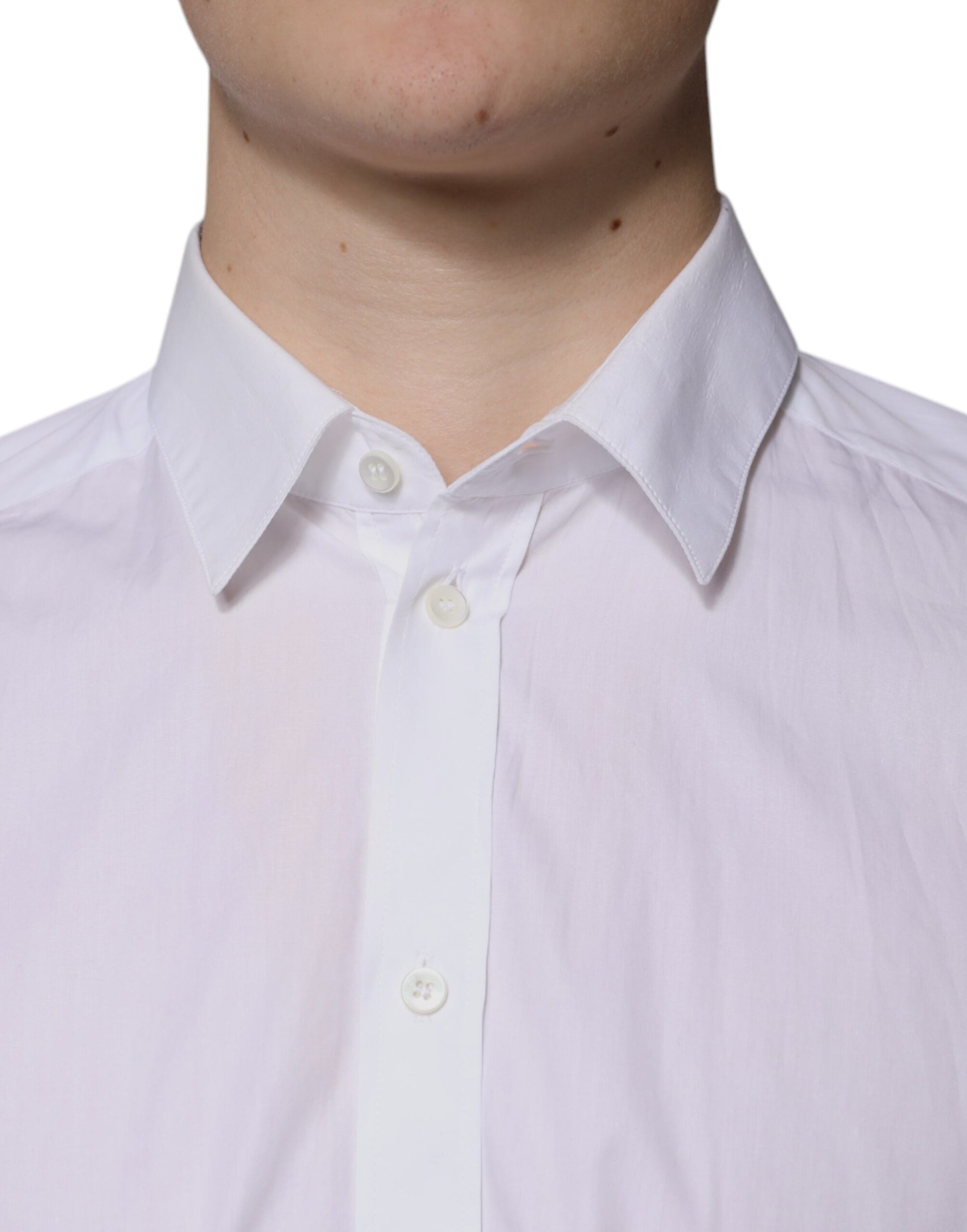 A white cotton long sleeve formal dress shirt with a collar and button front