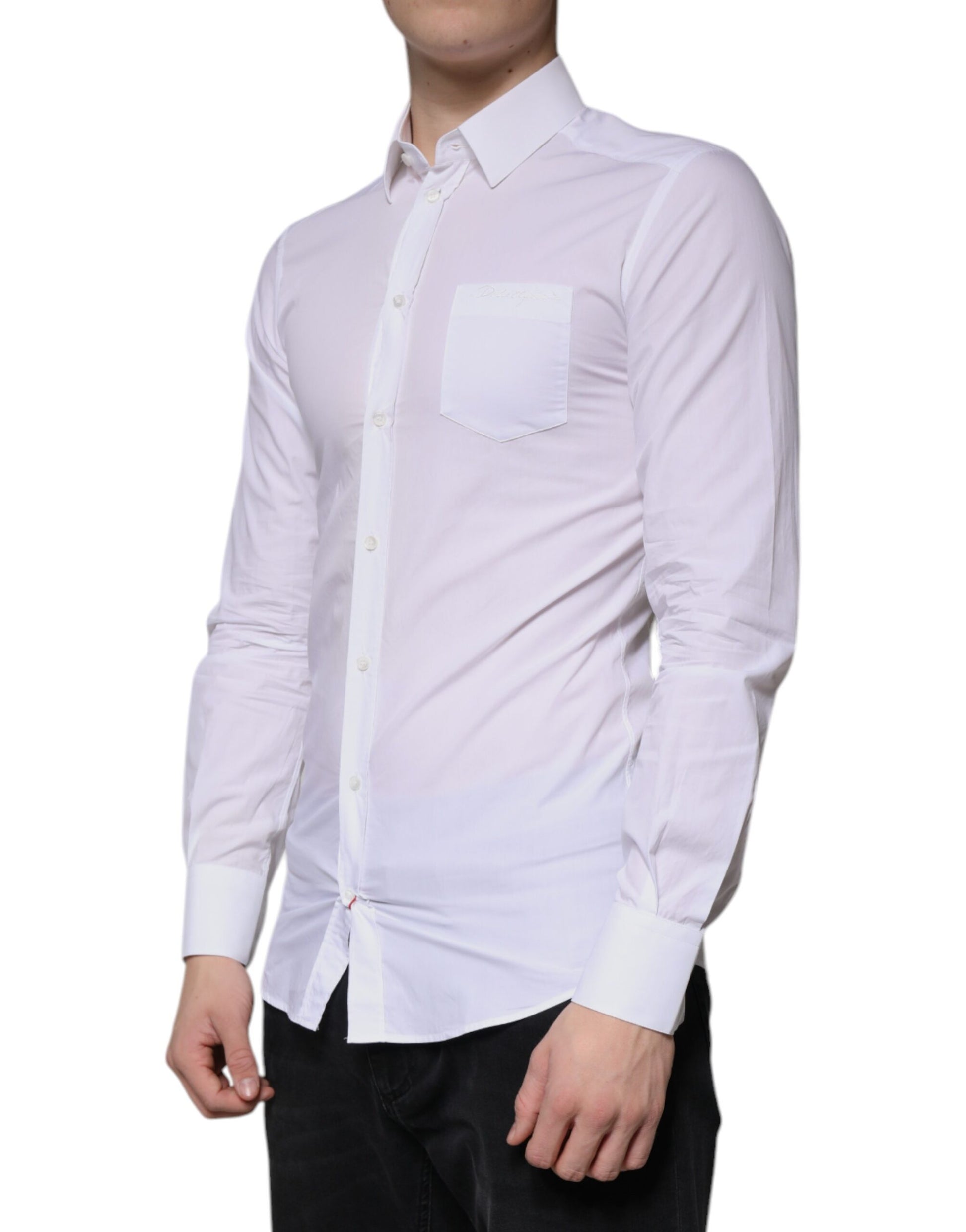 A long sleeved white cotton dress shirt with a collar and cuffs