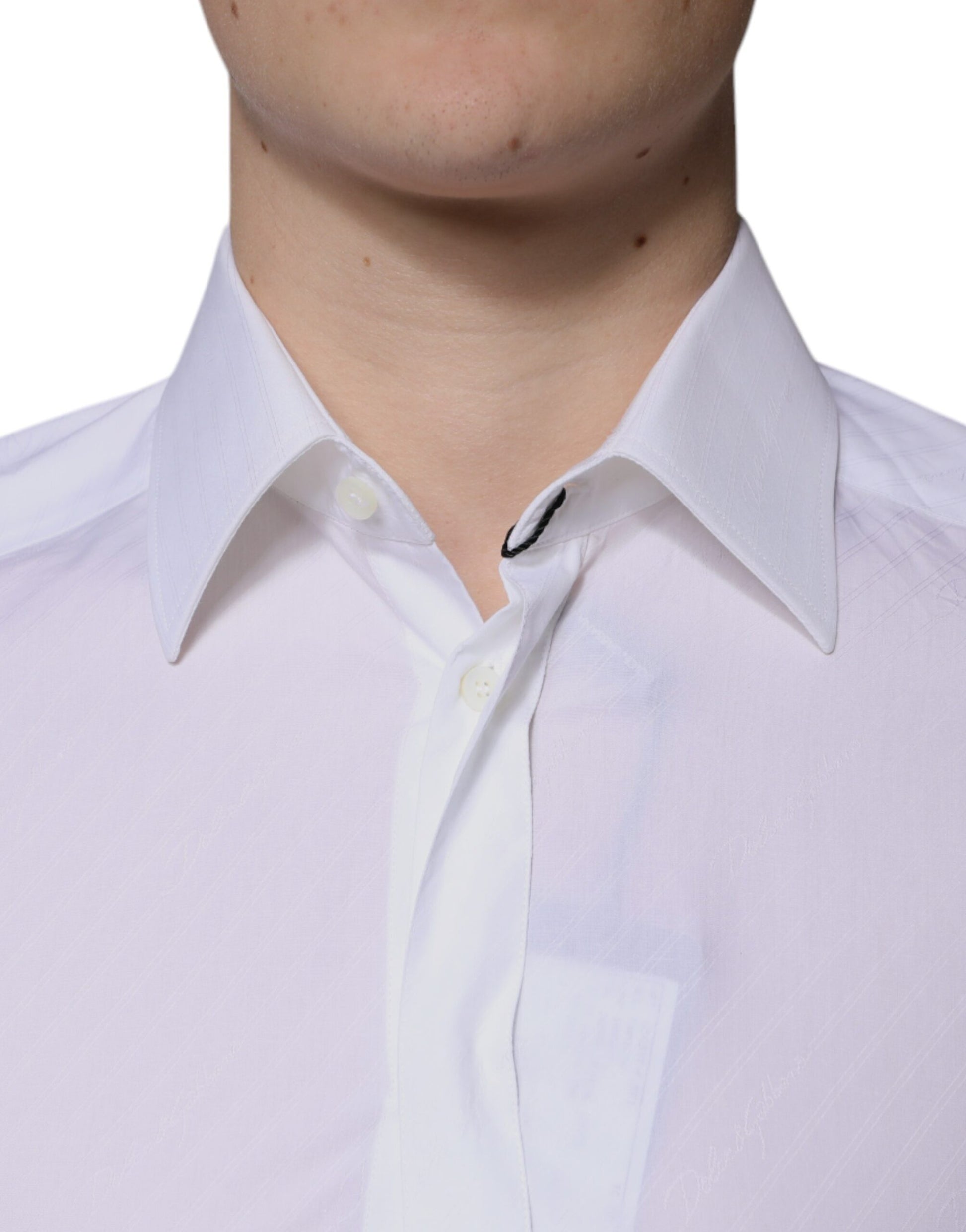 A white cotton long sleeve dress shirt with a gold collar and cuffs