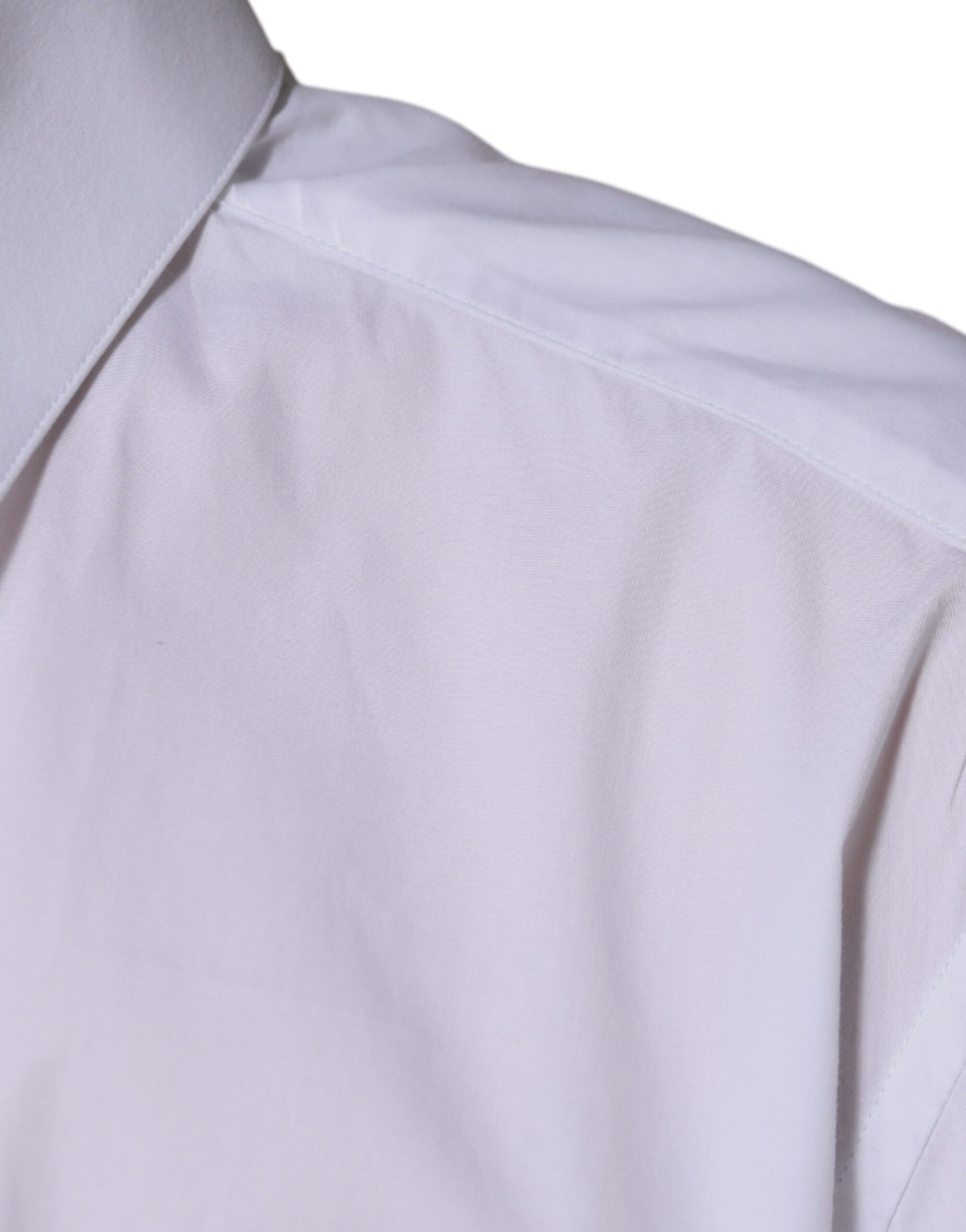 A white cotton long sleeve dress shirt with a gold design on the collar