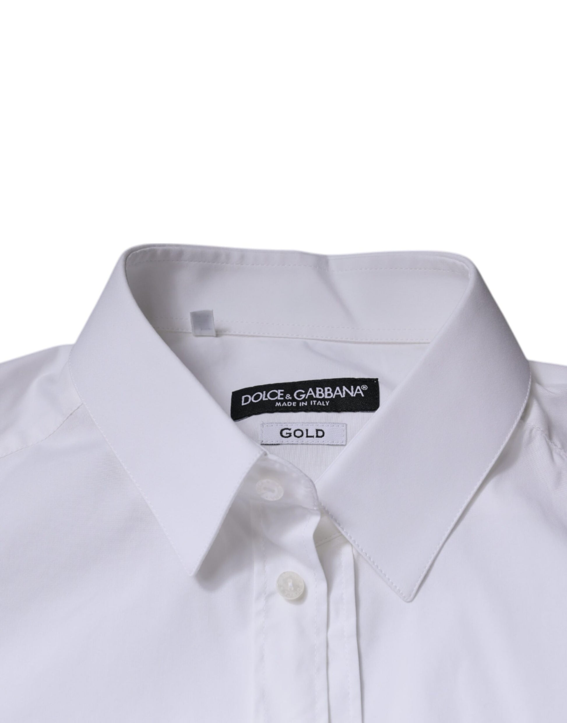 A white cotton long sleeve dress shirt with a gold label on the collar