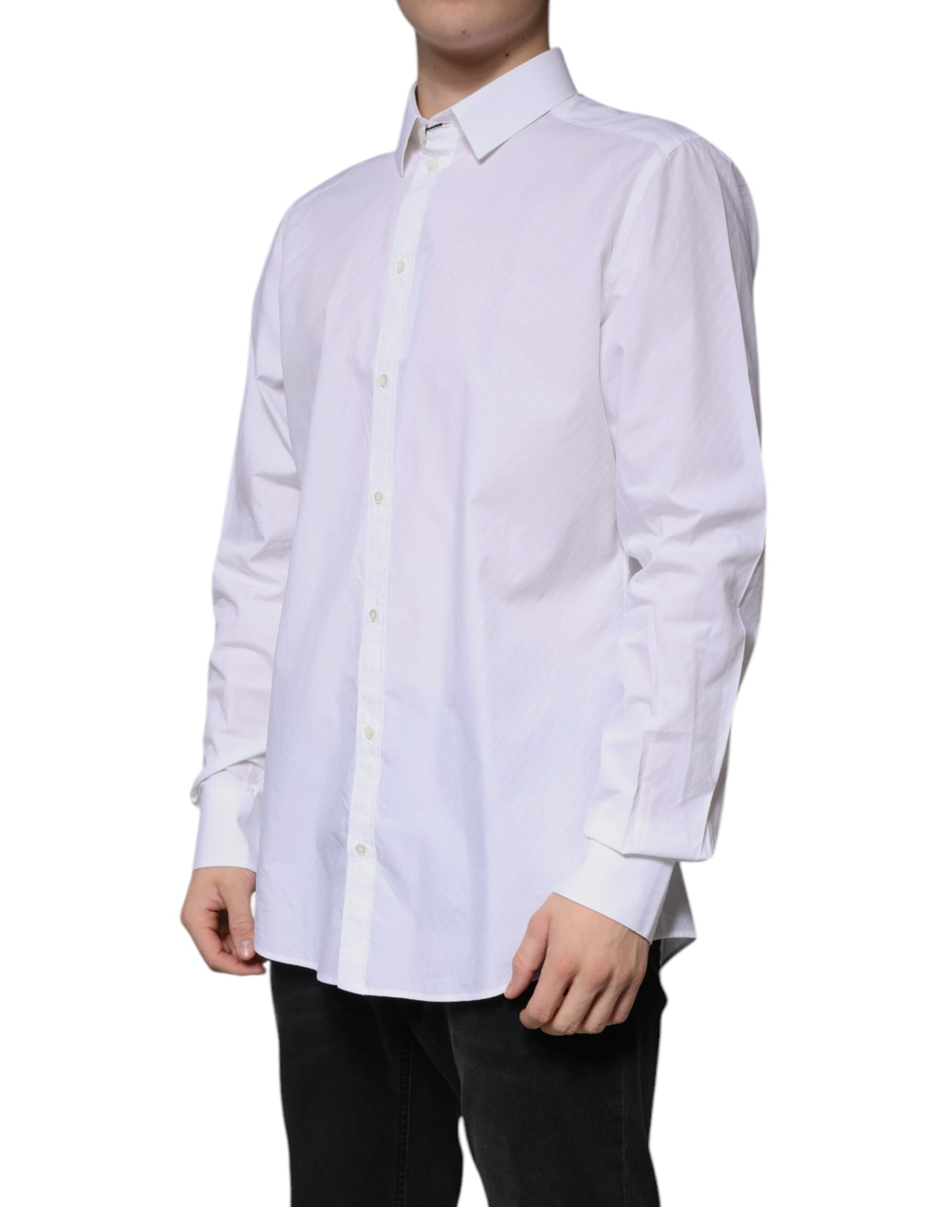 A long sleeved white cotton dress shirt with a collar and button-down front