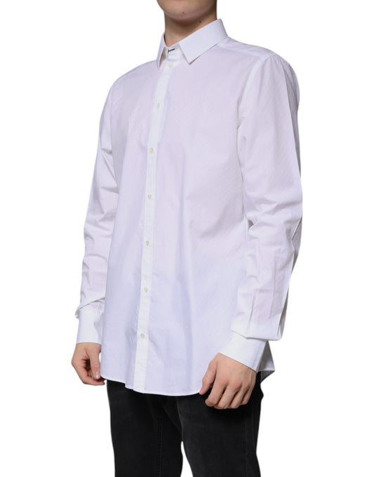 A long sleeved white cotton dress shirt with a collar and button-down front