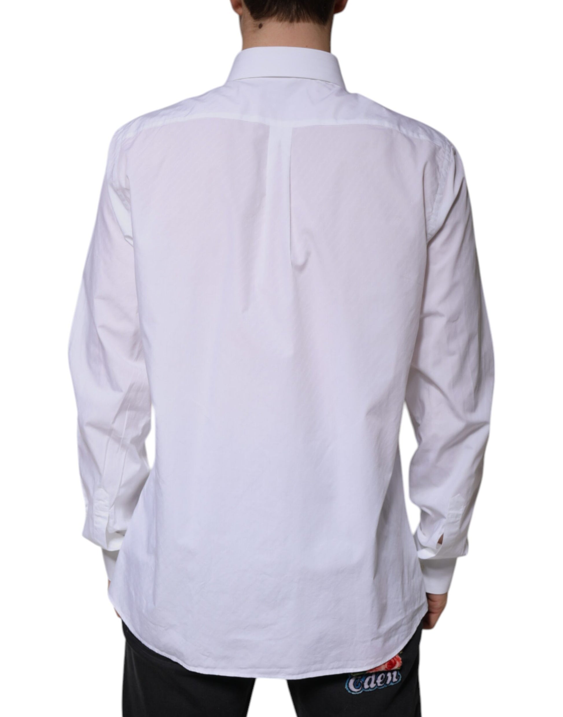 A long sleeved white cotton dress shirt with a collar and button-down front