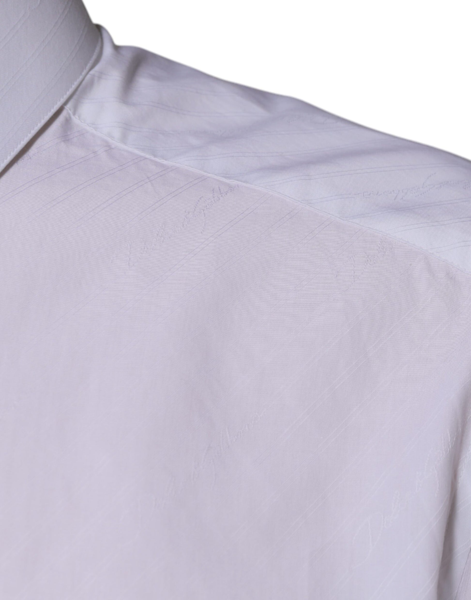 A long sleeved white cotton dress shirt with a collar and buttoned front