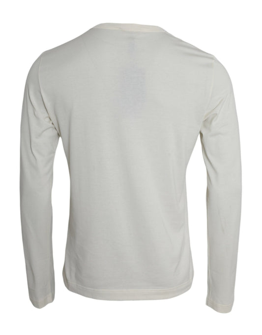 A long sleeve t-shirt with a white and beige striped pattern