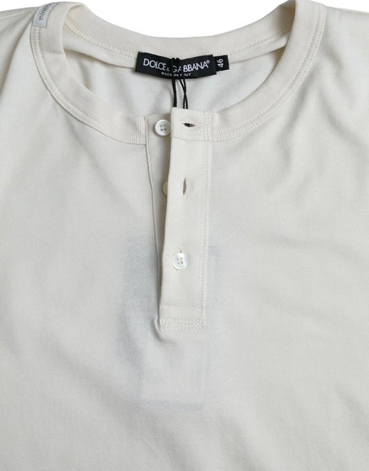 A long sleeve t-shirt with a buttoned front and a label on the collar
