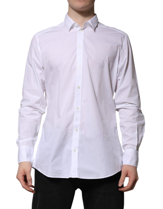 A long sleeve white cotton dress shirt with a collar and button-up front