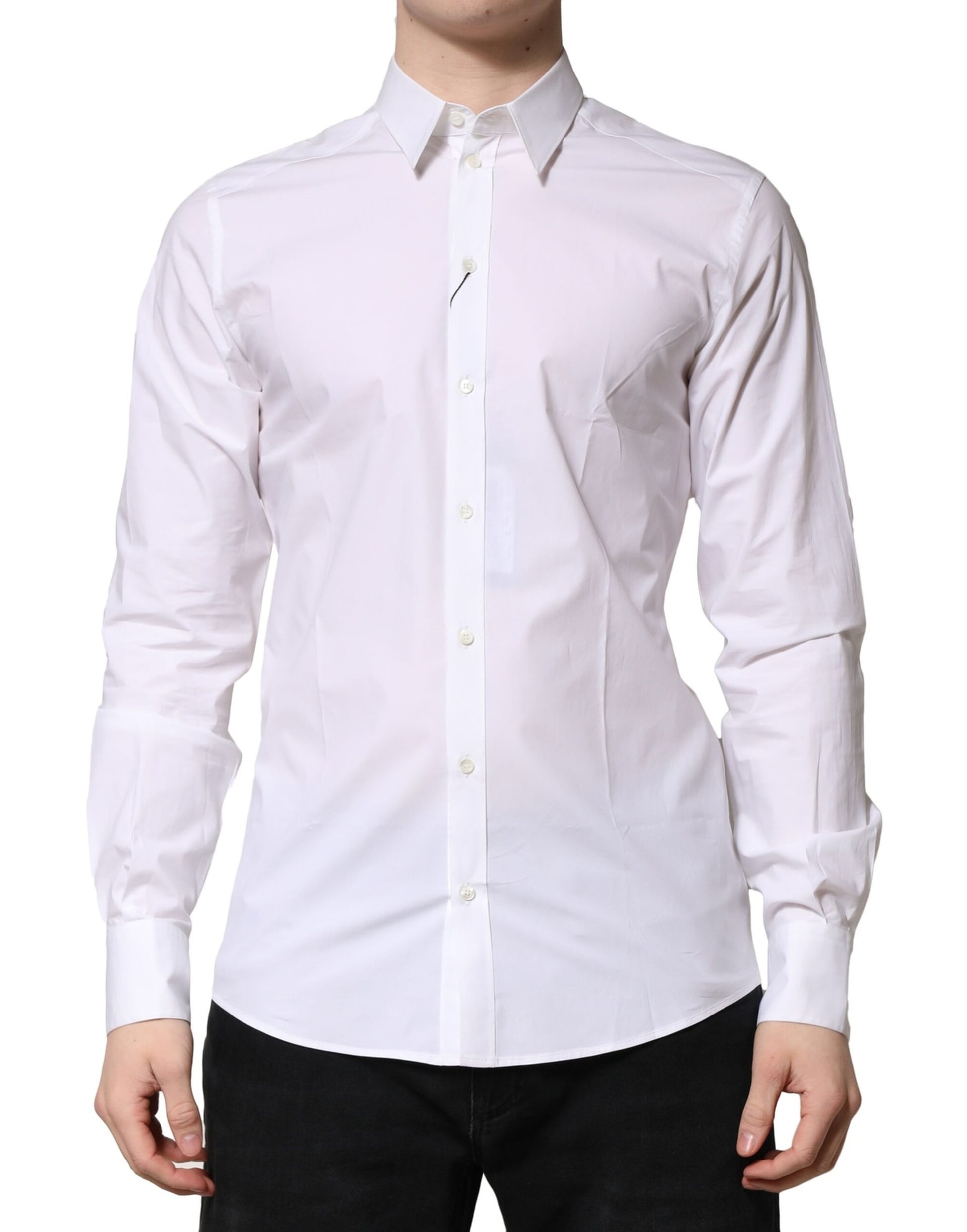 A person wearing a white cotton long sleeve dress shirt