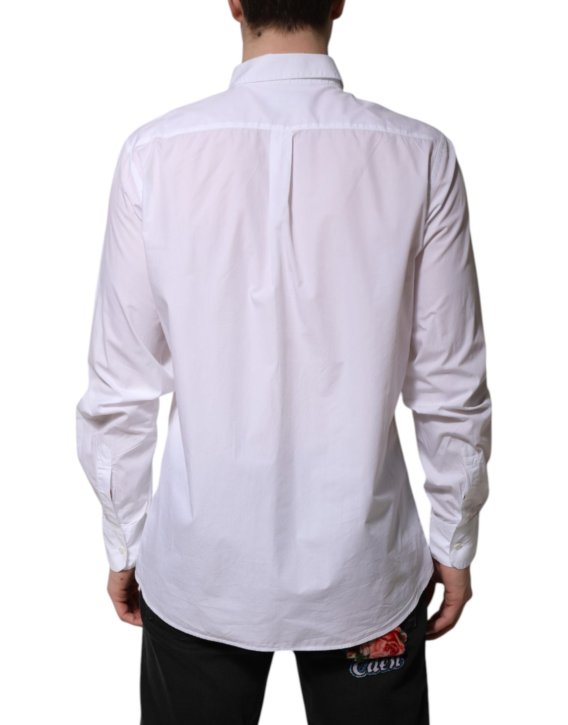 A long sleeve white cotton dress shirt with a collar and button-up front