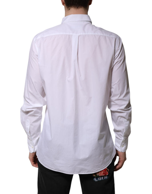 A long sleeve white cotton dress shirt with a collar and button-up front