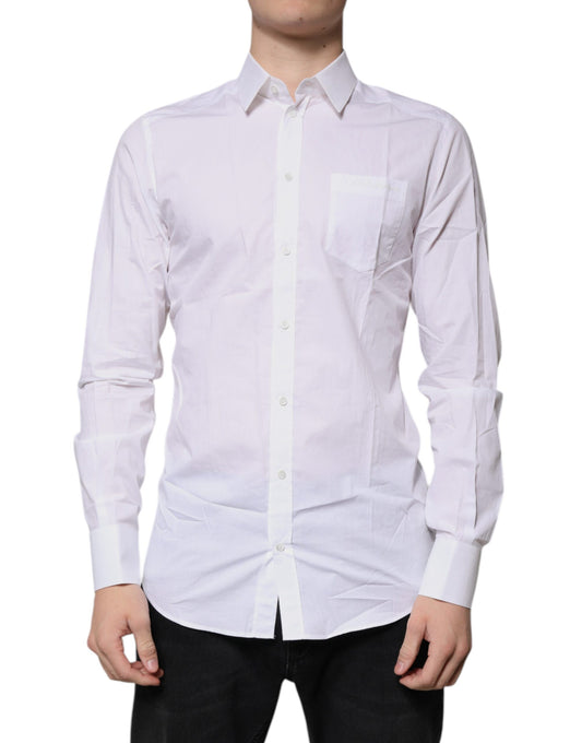 A long sleeve white cotton dress shirt with a collar and button-down front