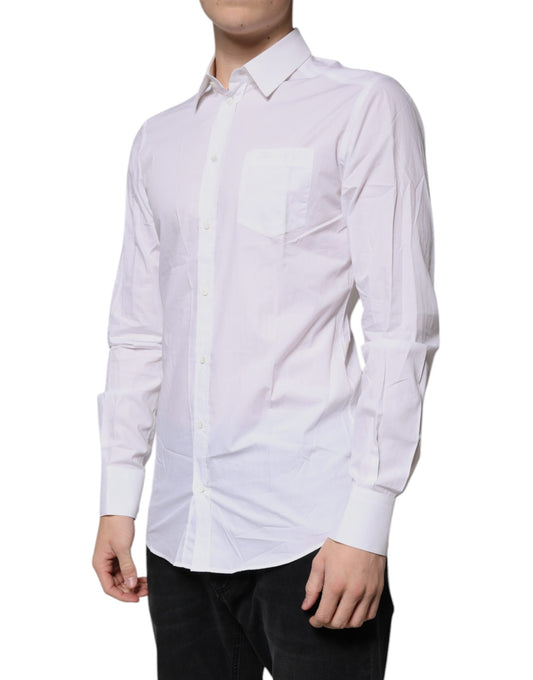 A long sleeve white cotton dress shirt with a collar and button-up front