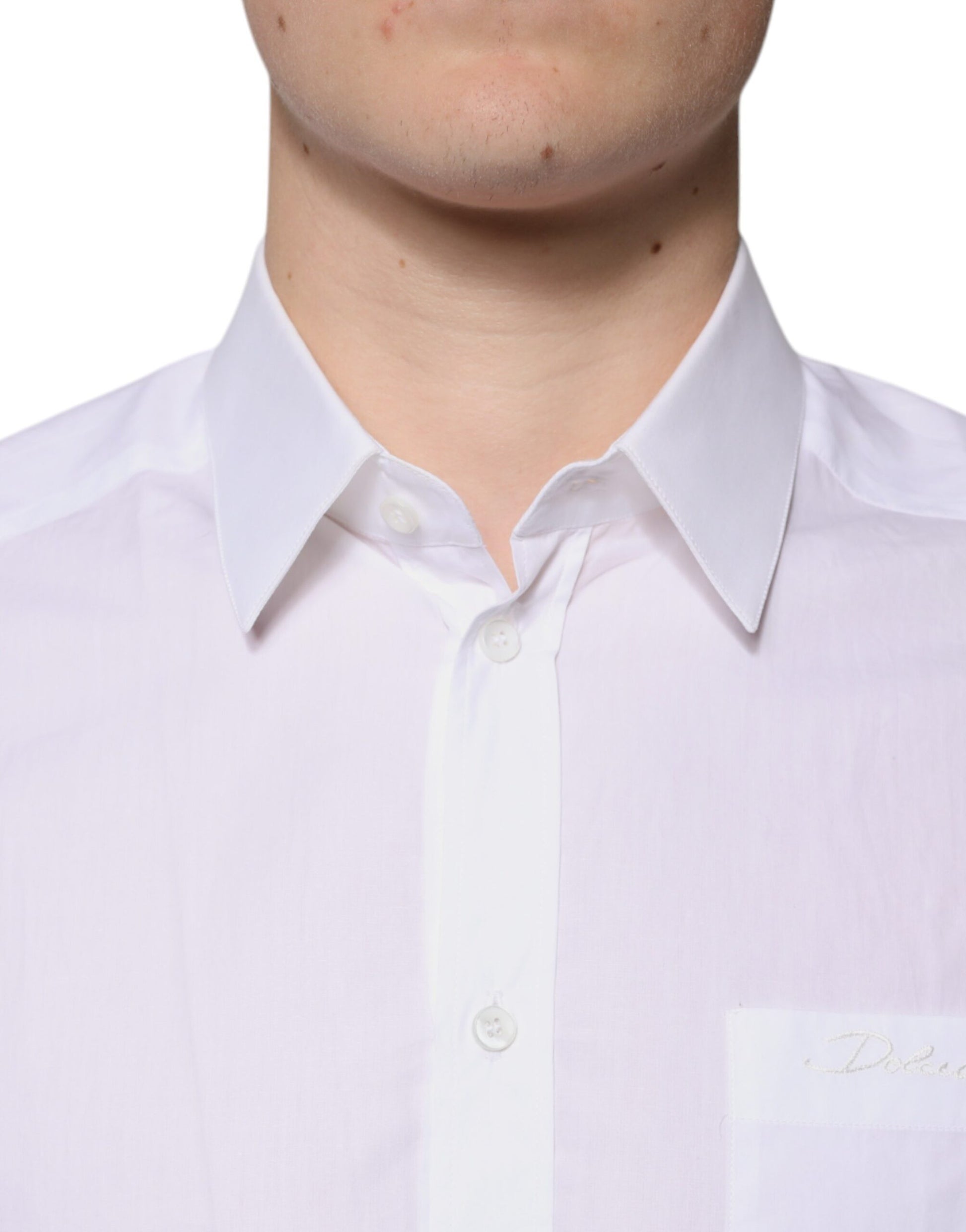 A mannequin wearing a white cotton long sleeve dress shirt with gold accents