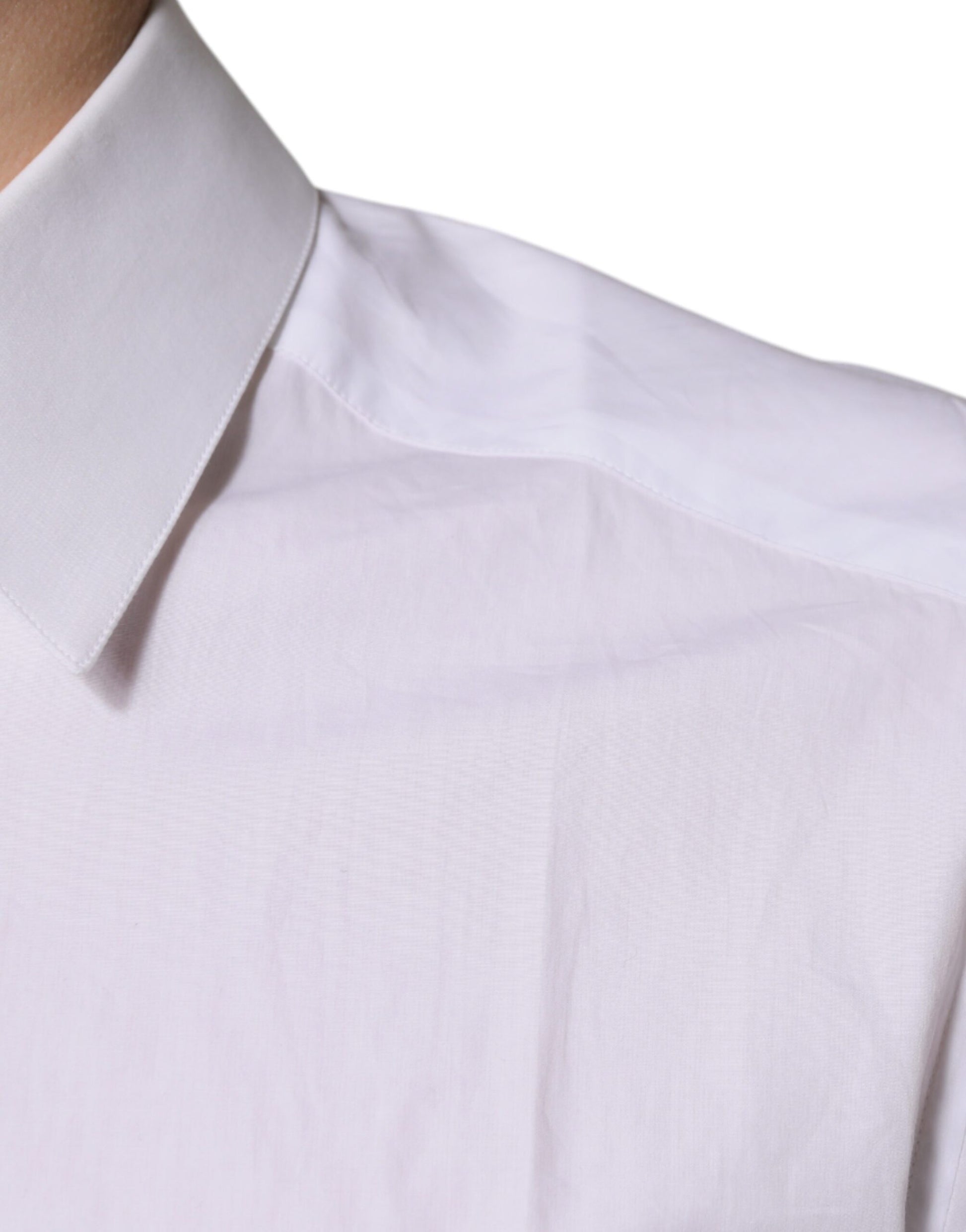 A white cotton dress shirt with long sleeves and a collar, featuring a gold design
