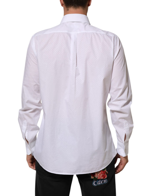 A white cotton shirt with a bib front and floral embroidery on the back