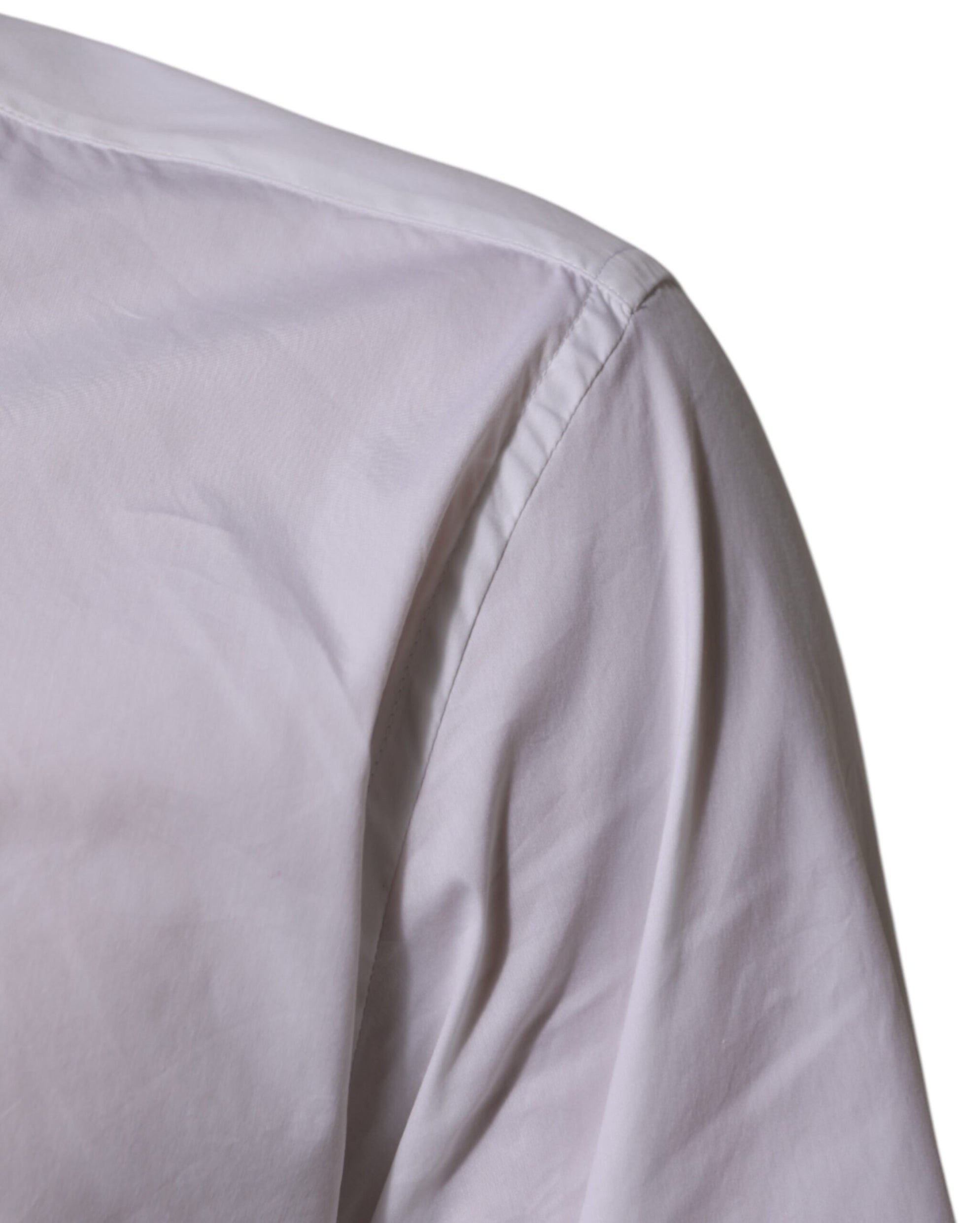A white cotton dress shirt with a collar and long sleeves, designed for formal wear