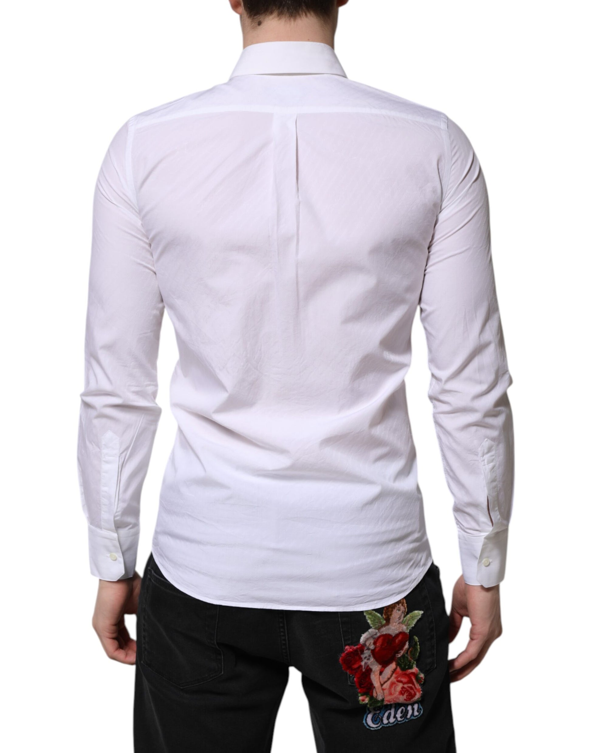 A long sleeved white cotton dress shirt with a floral embroidery on the back