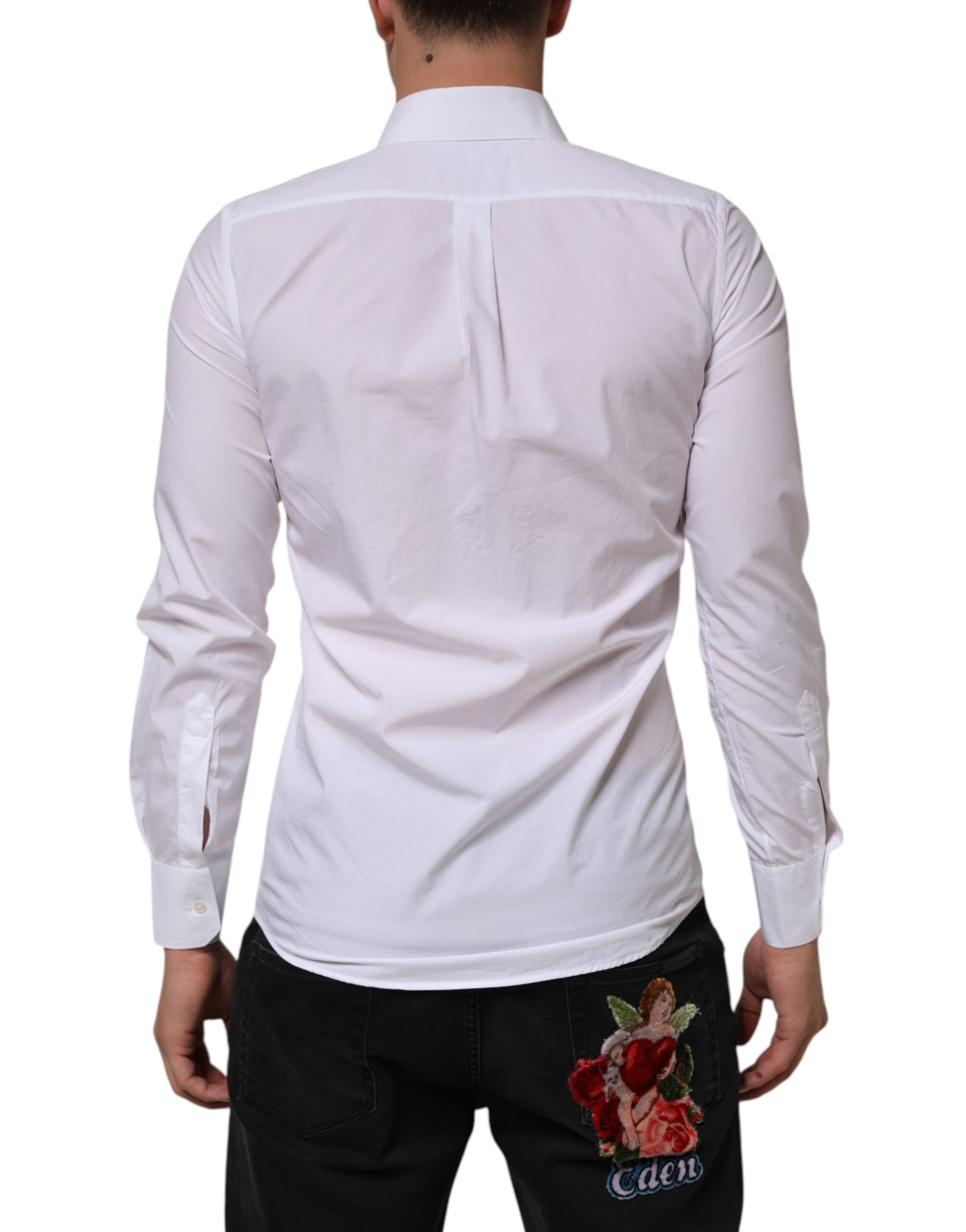 A white cotton dress shirt with long sleeves, featuring a collar and a back pocket
