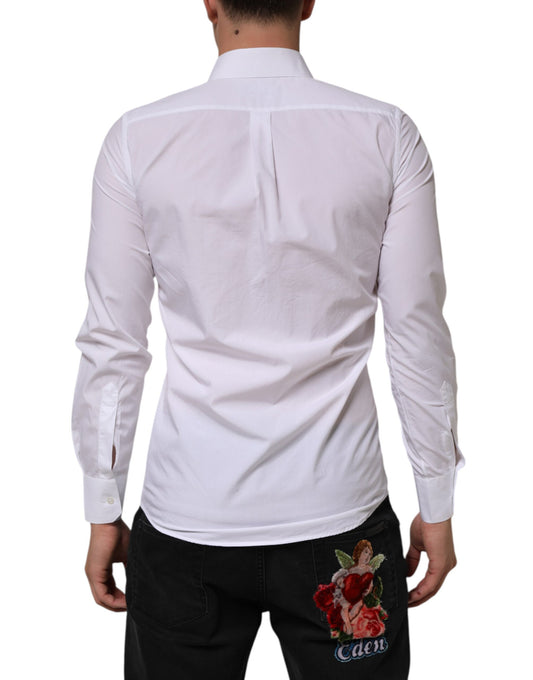 A white cotton dress shirt with long sleeves, featuring a collar and a back pocket