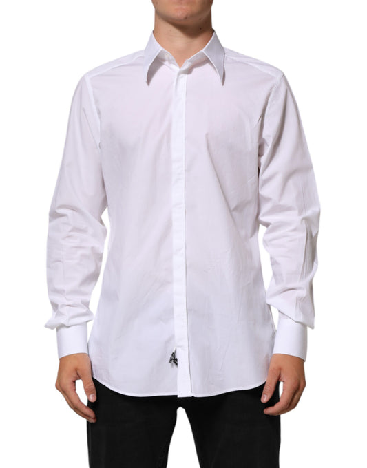 A long-sleeved white cotton dress shirt with a collar and buttoned front