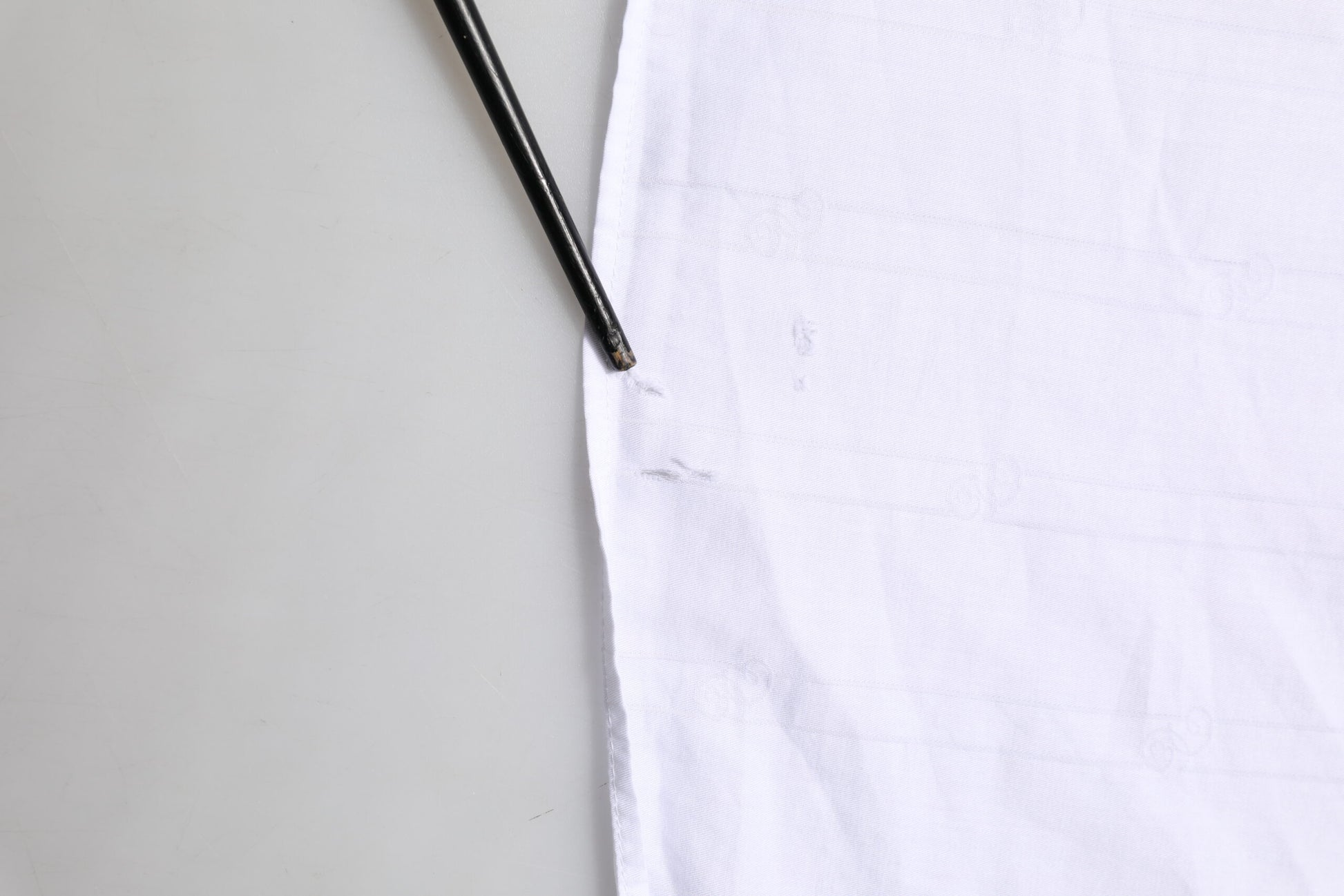 A white cotton dress shirt with a collar and button-up front, from the brand Dolce & Gabbana