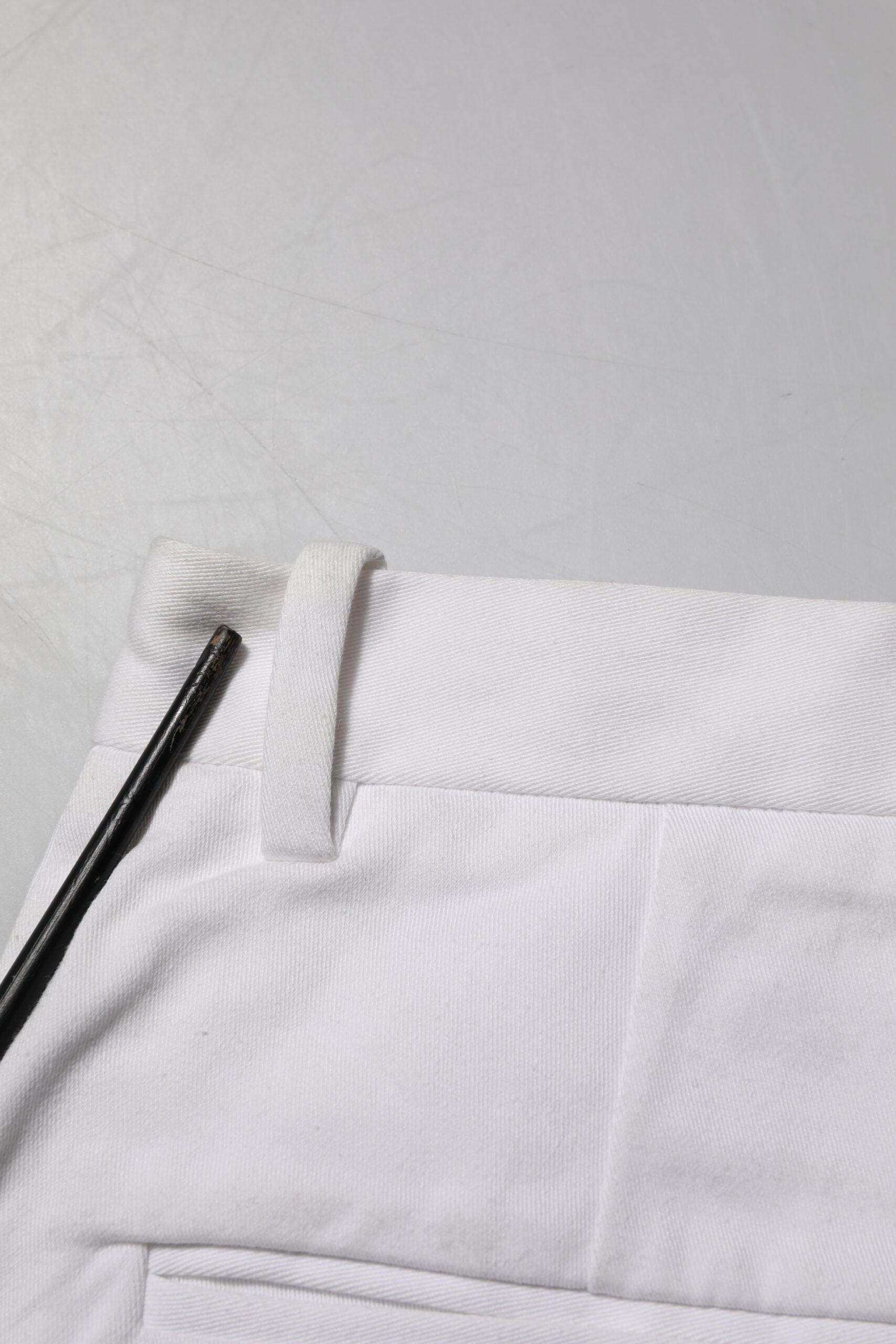 White pants with black zipper