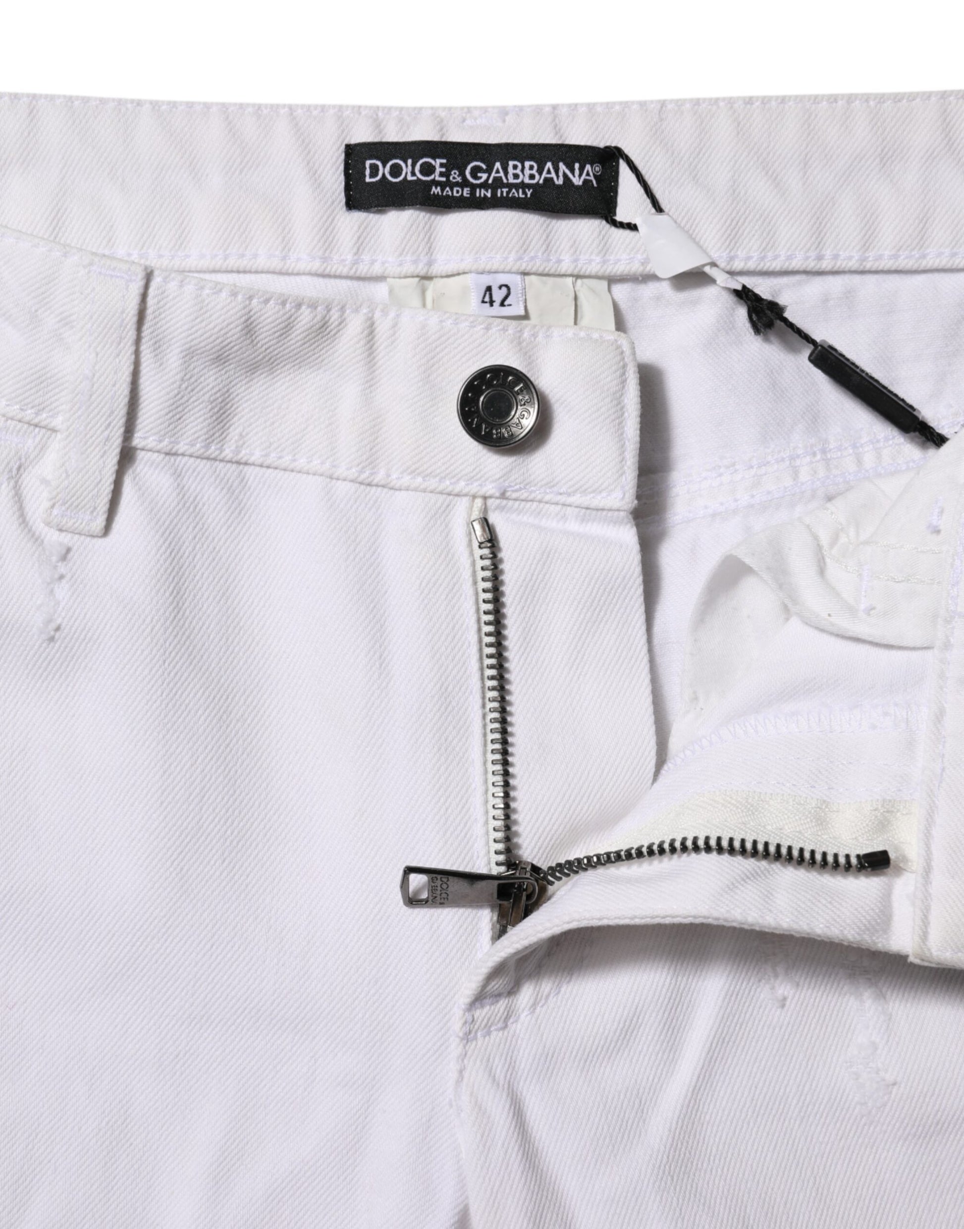 White pants with zipper detail on side