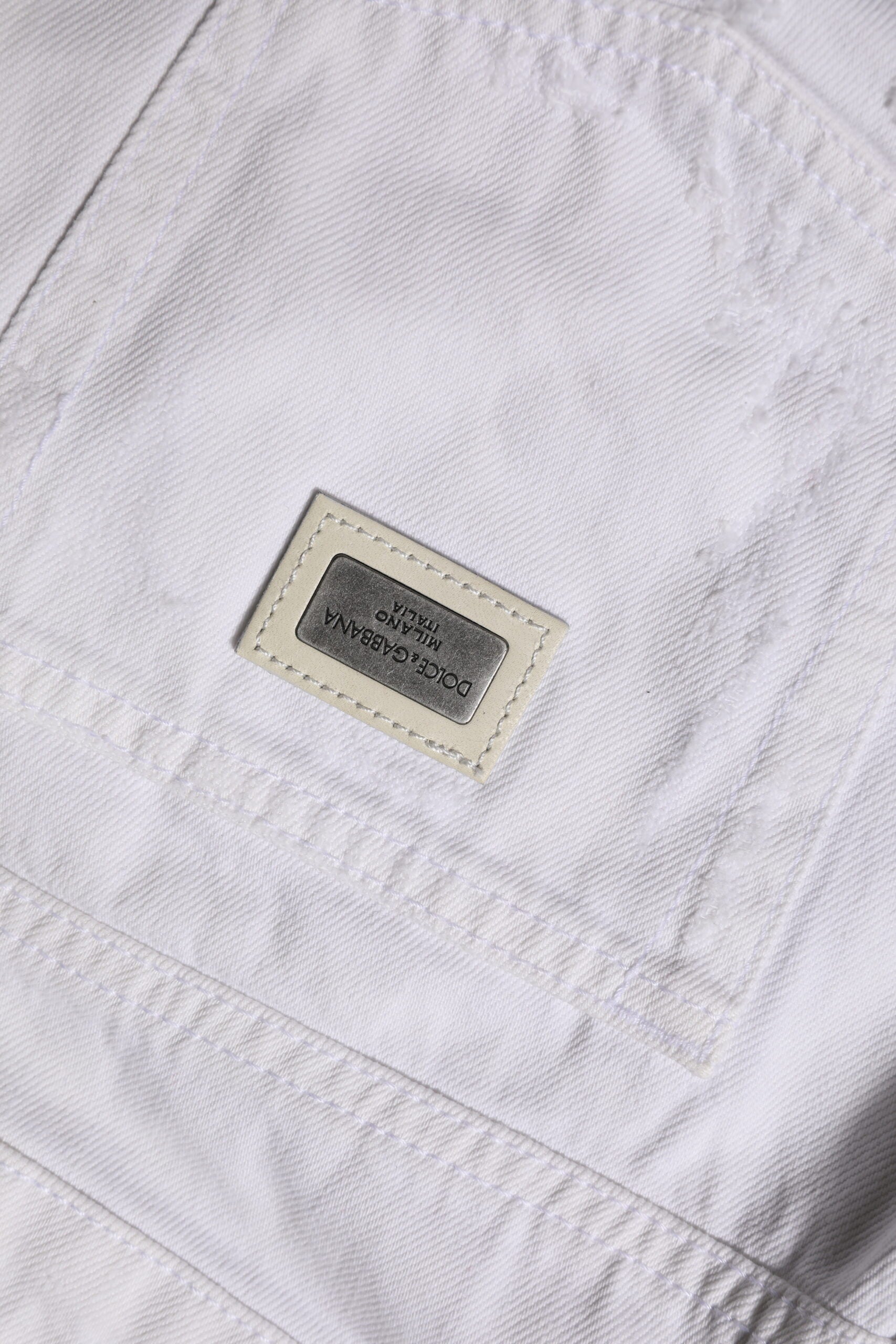 White shirt with a label on the left chest area