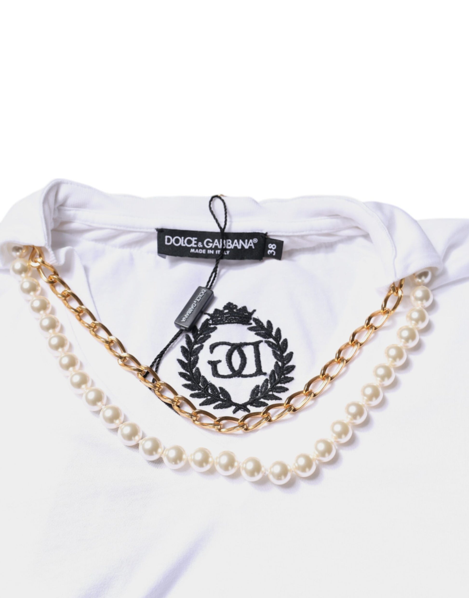 White t-shirt with gold chain necklace and pearl pendant