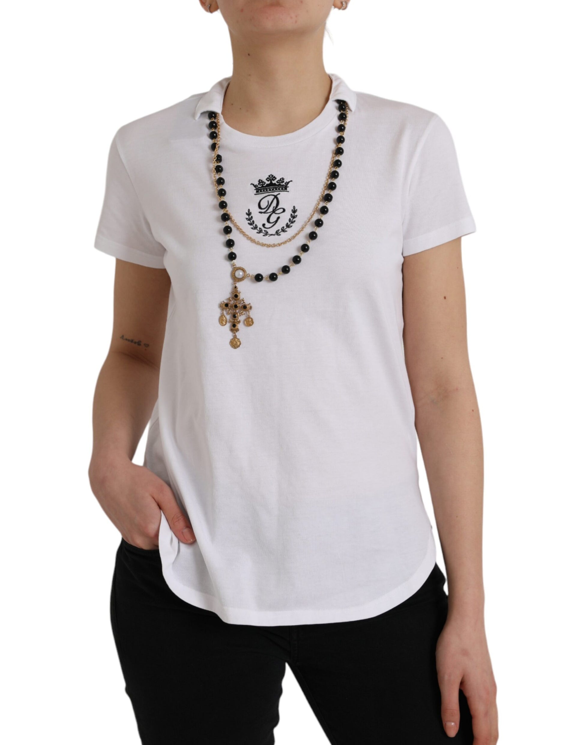 Woman wearing white t-shirt with cross pendant necklace