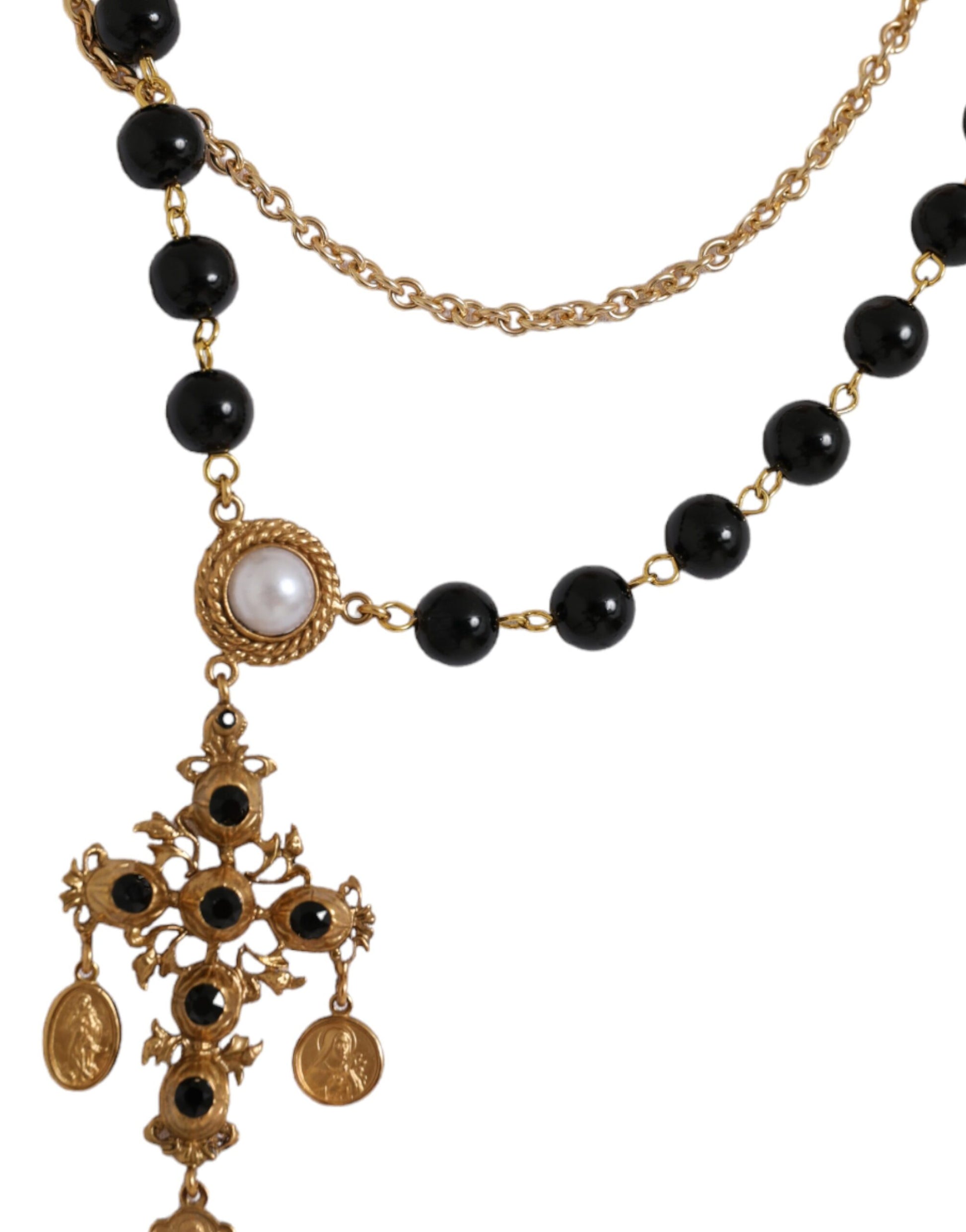 Gold necklace with black beads and a cross pendant
