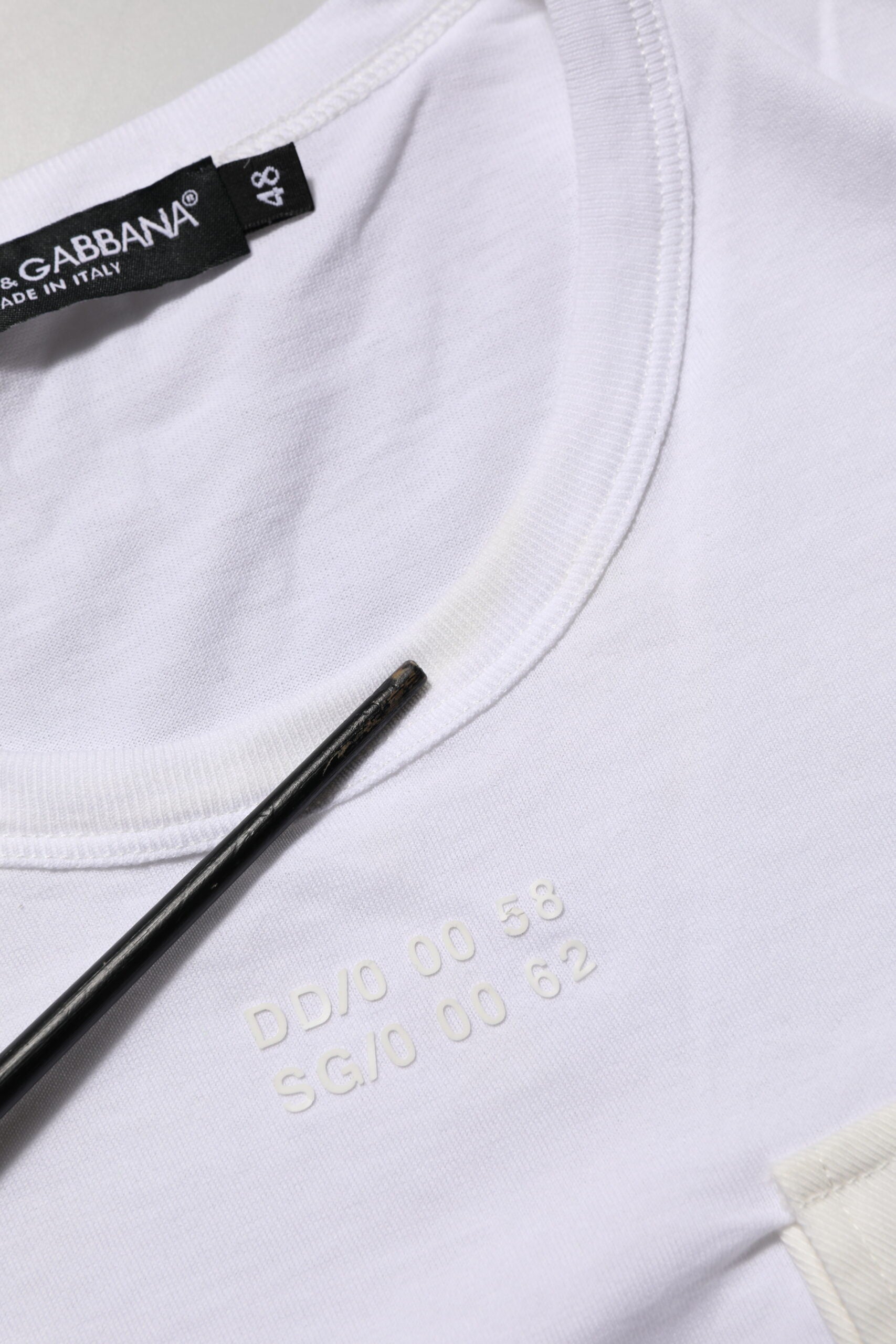 White t-shirt with black writing on neckline