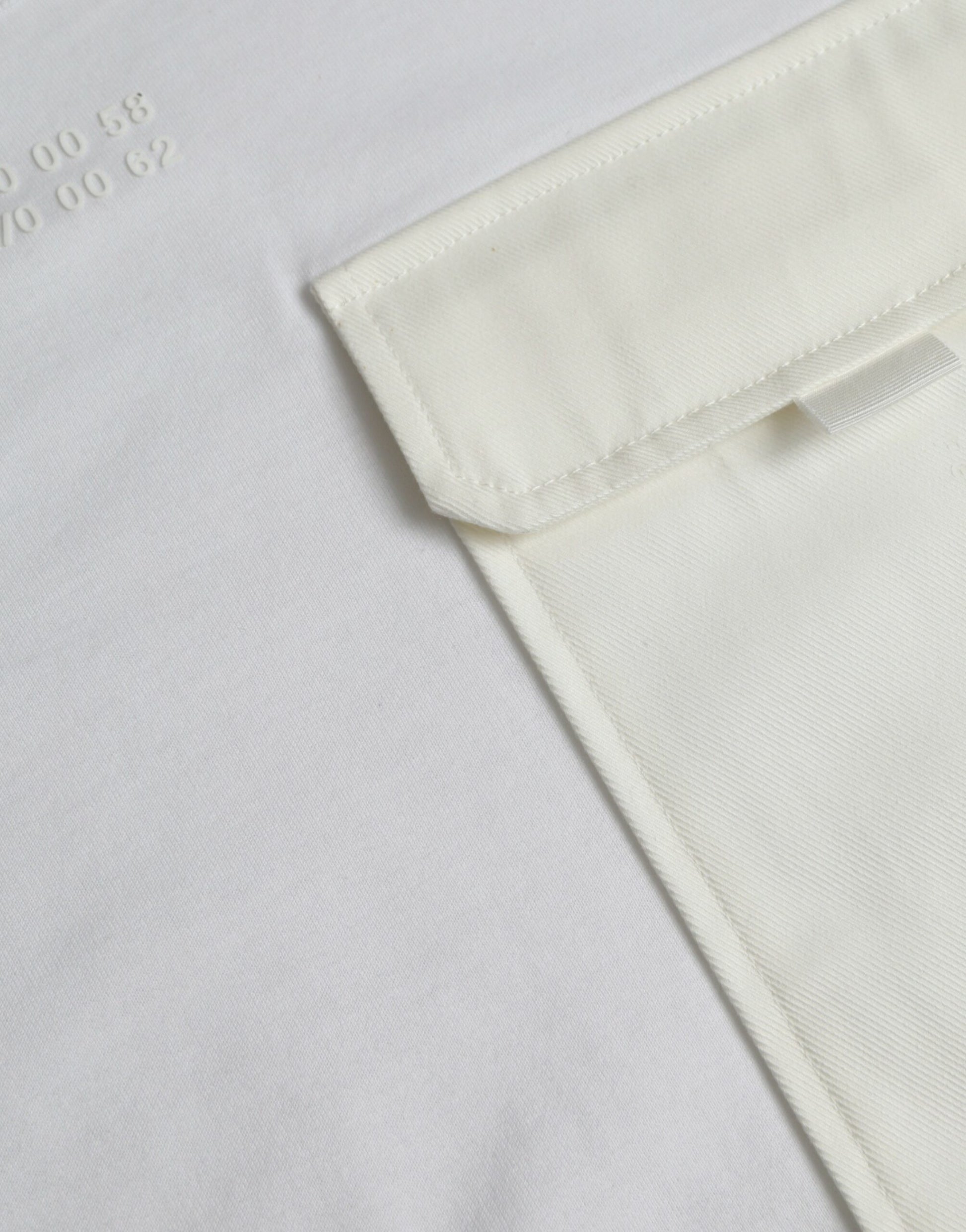 White shirt with a pocket on the left side