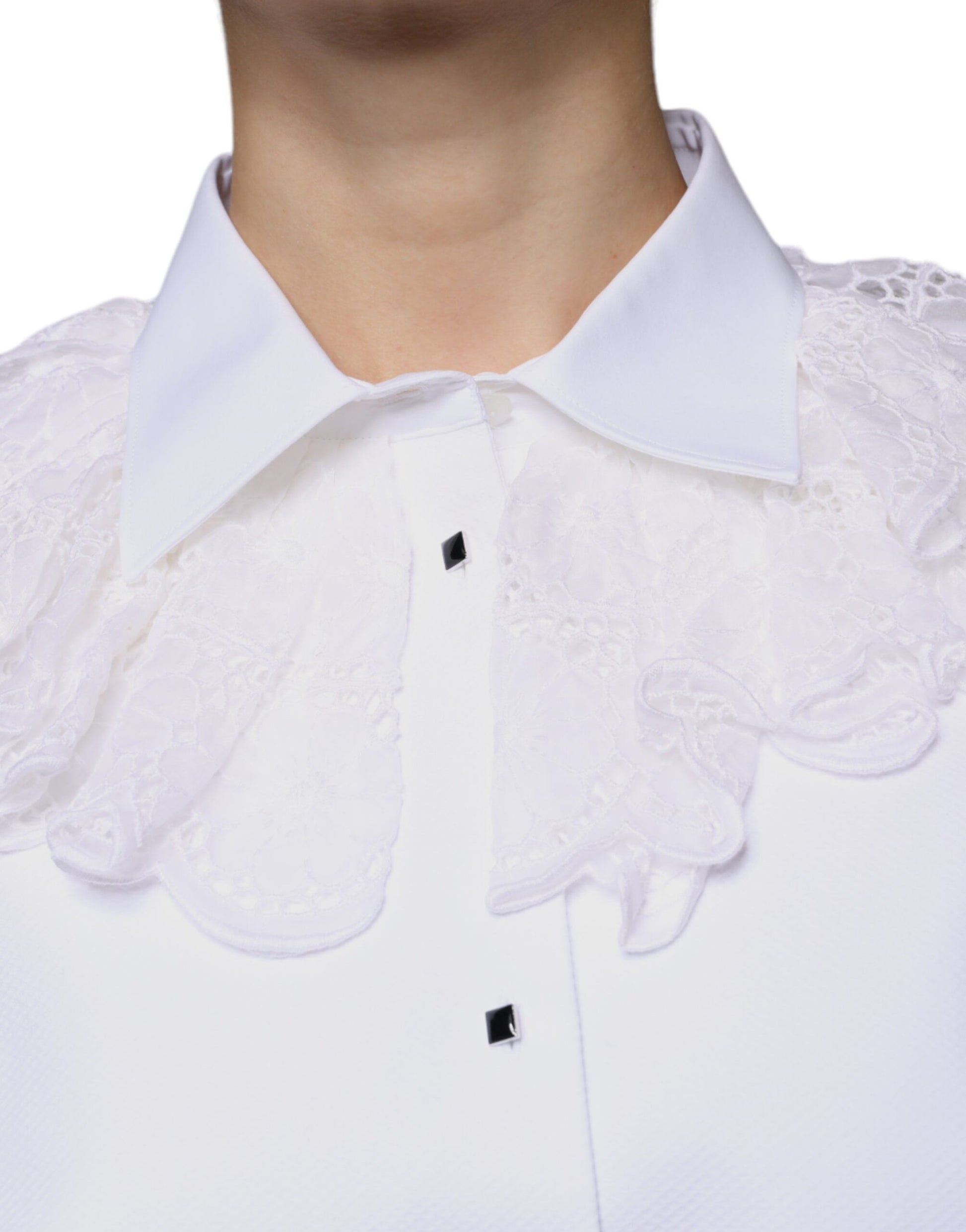 A white cotton poplin shirt dress with lace detailing at the neckline and sleeves