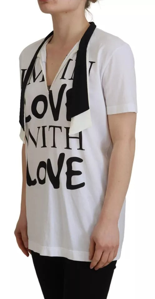 Woman wearing white t-shirt with black lettering