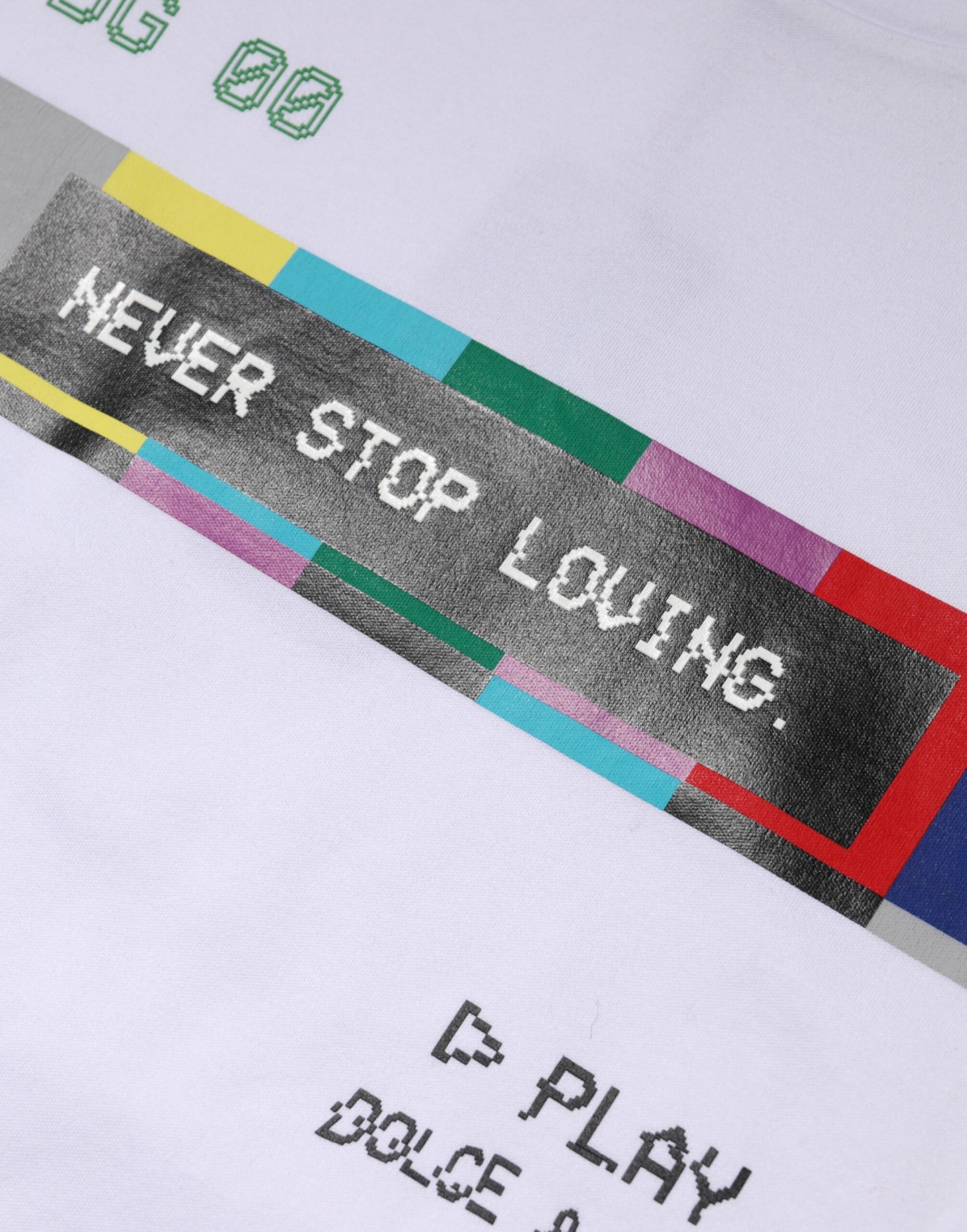 White t-shirt with colorful graphic design on front