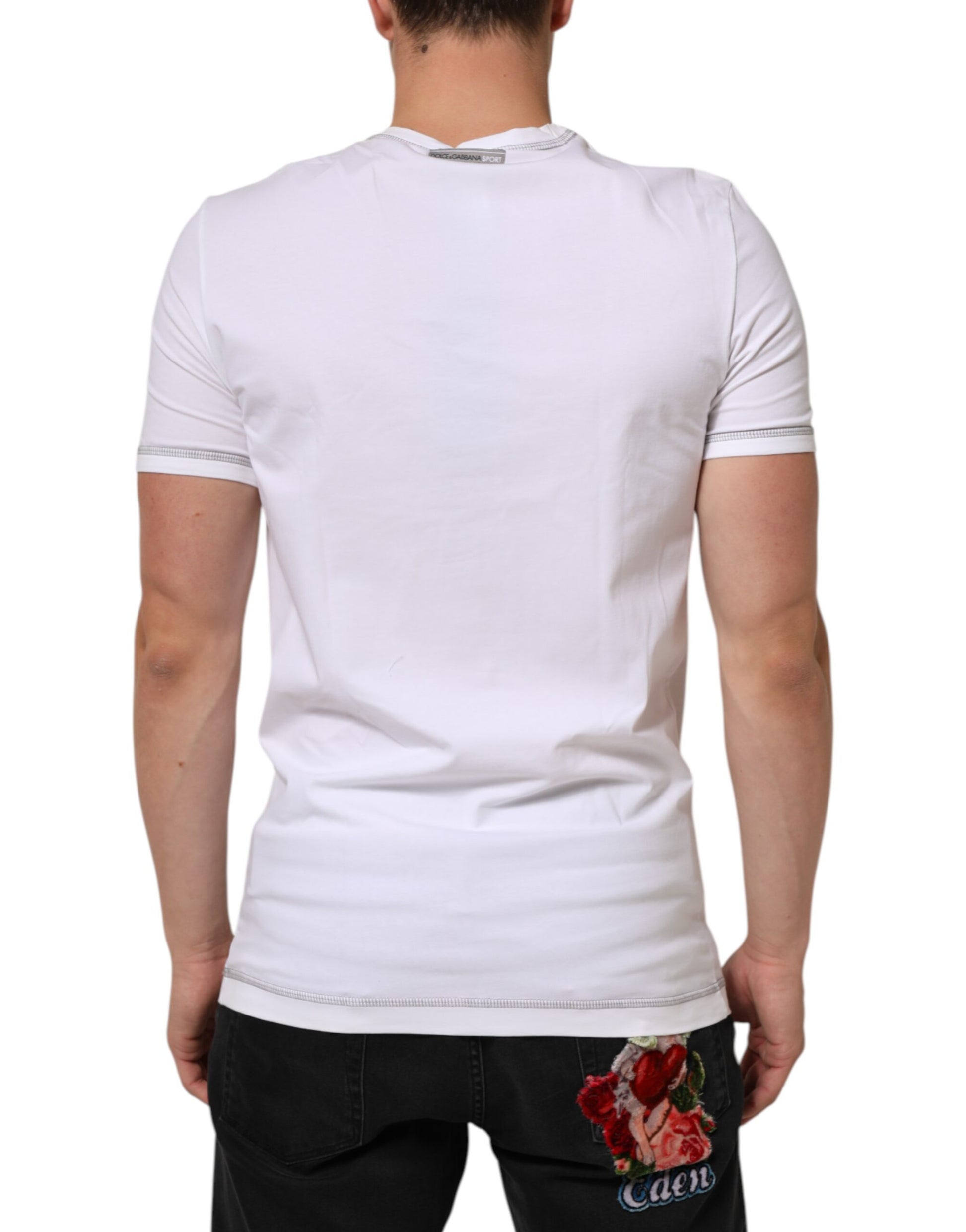 White short sleeve t-shirt with a small red flower on the back
