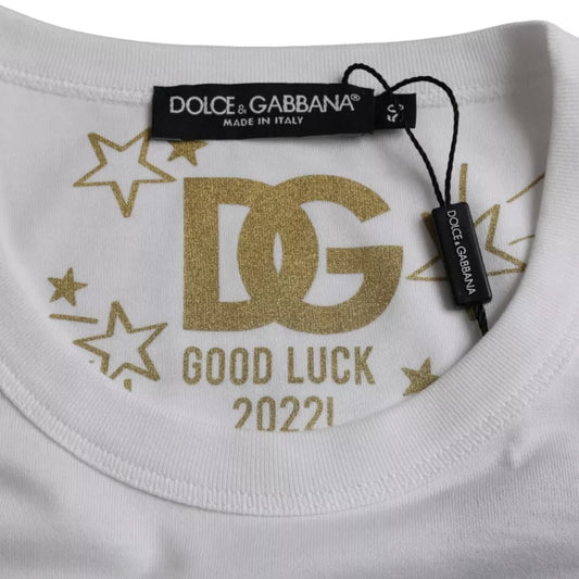 White t-shirt with gold lettering and stars