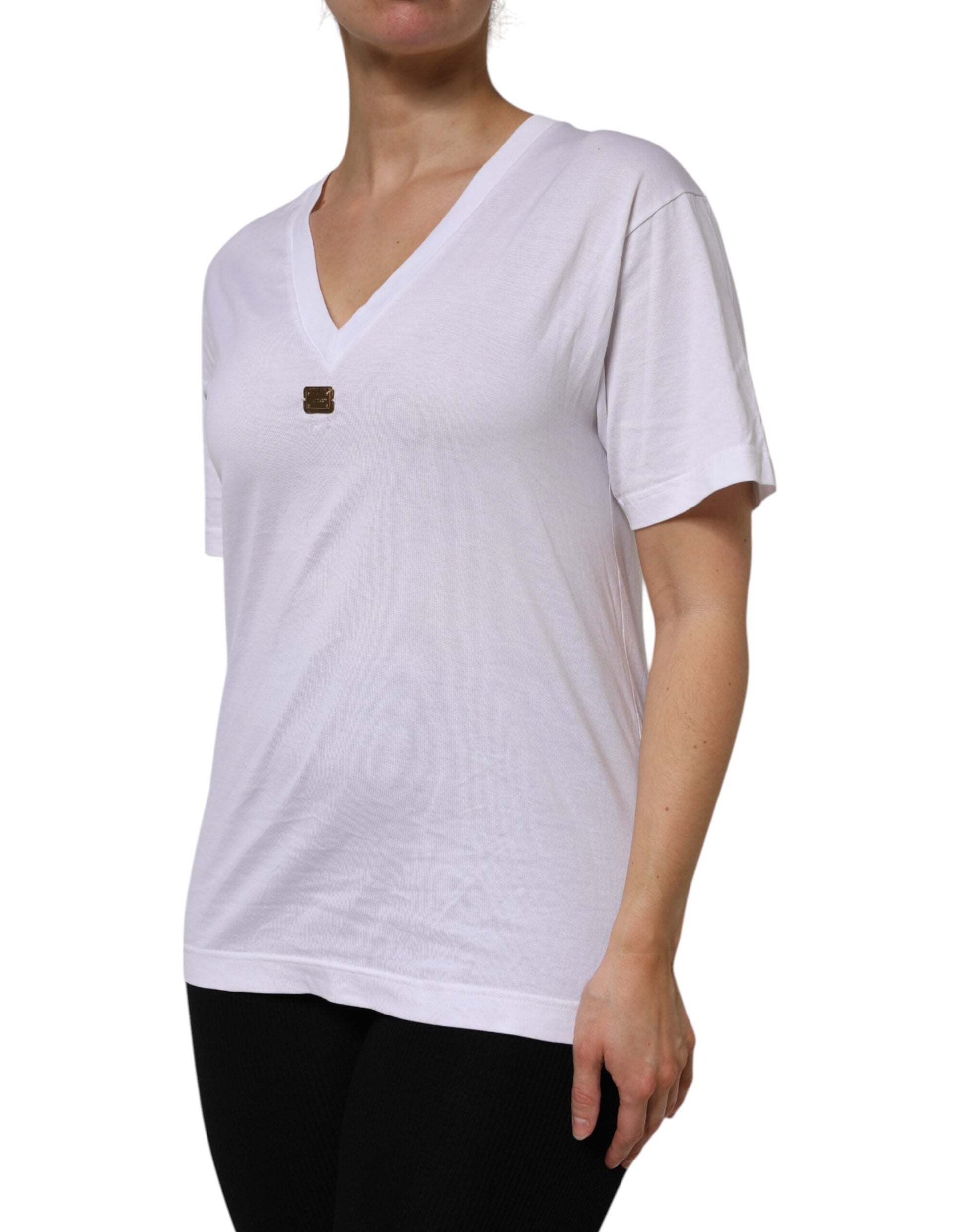 Woman wearing white shirt with brown button