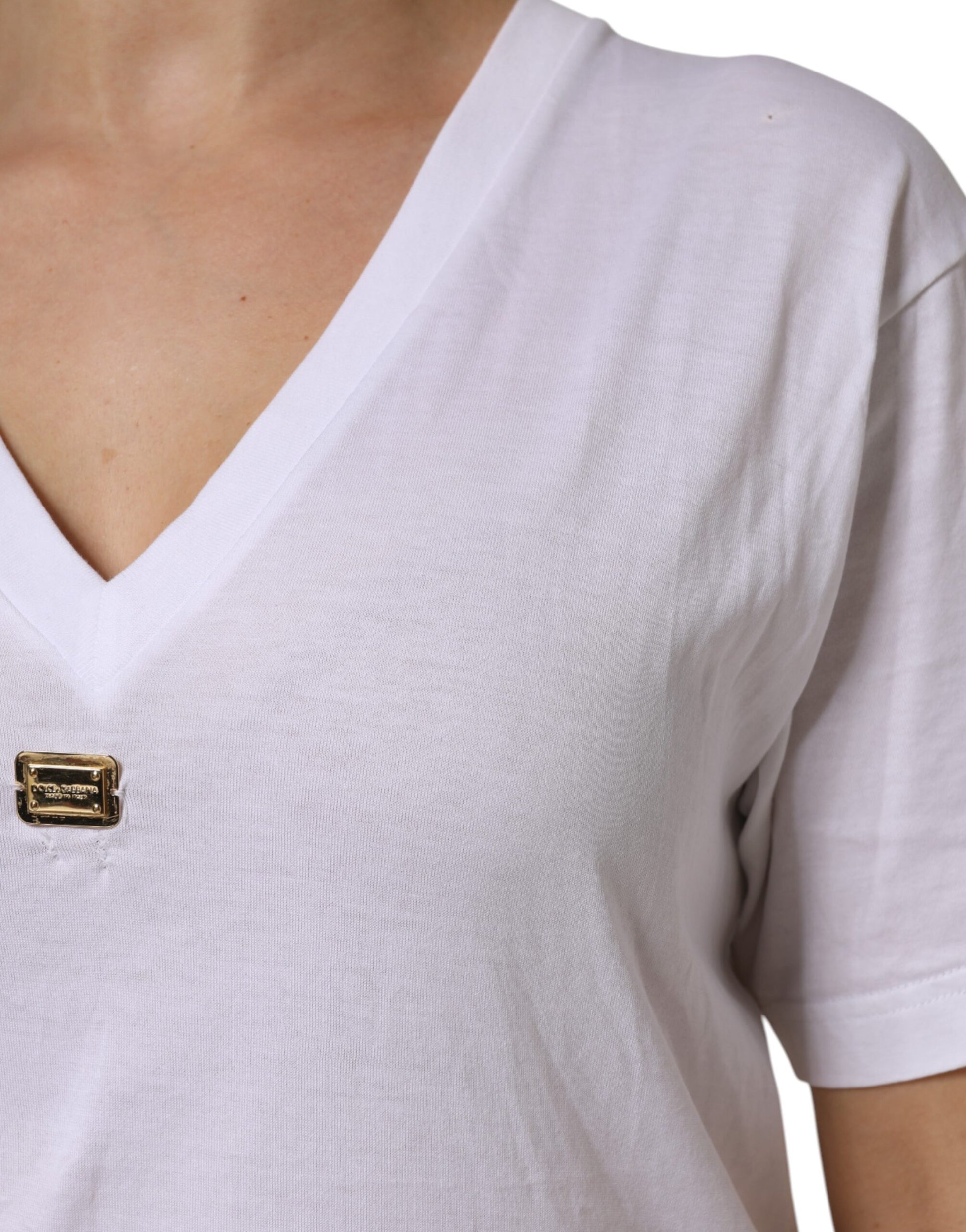 White v-neck shirt with button detail on front