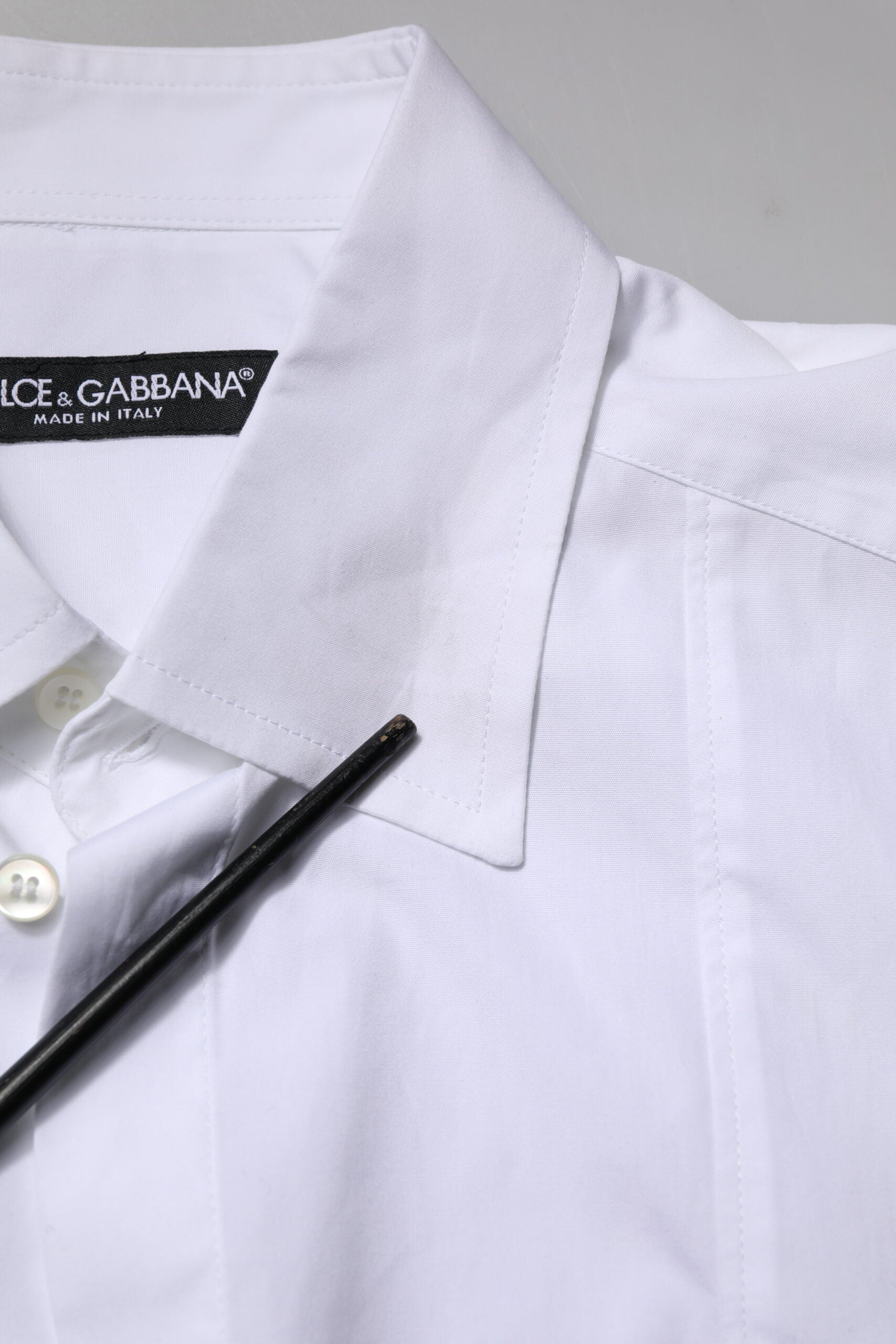 White polo shirt on hanger